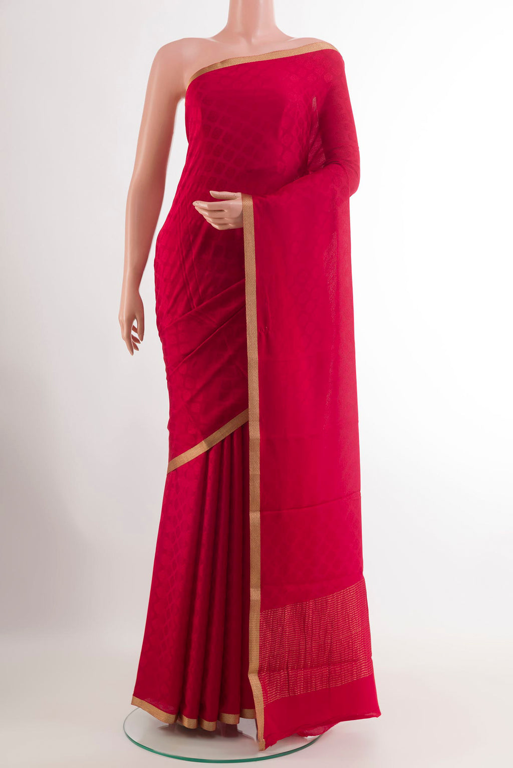 Red Mysore Crepe Saree with Jacquard design on the body and Zari Border.  displayed on a mannequin