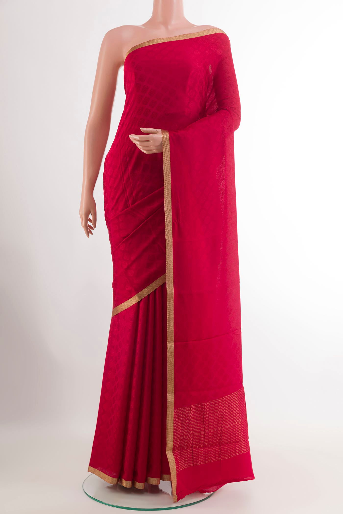 Red Mysore Crepe Saree with Jacquard design on the body and Zari Border.  displayed on a mannequin