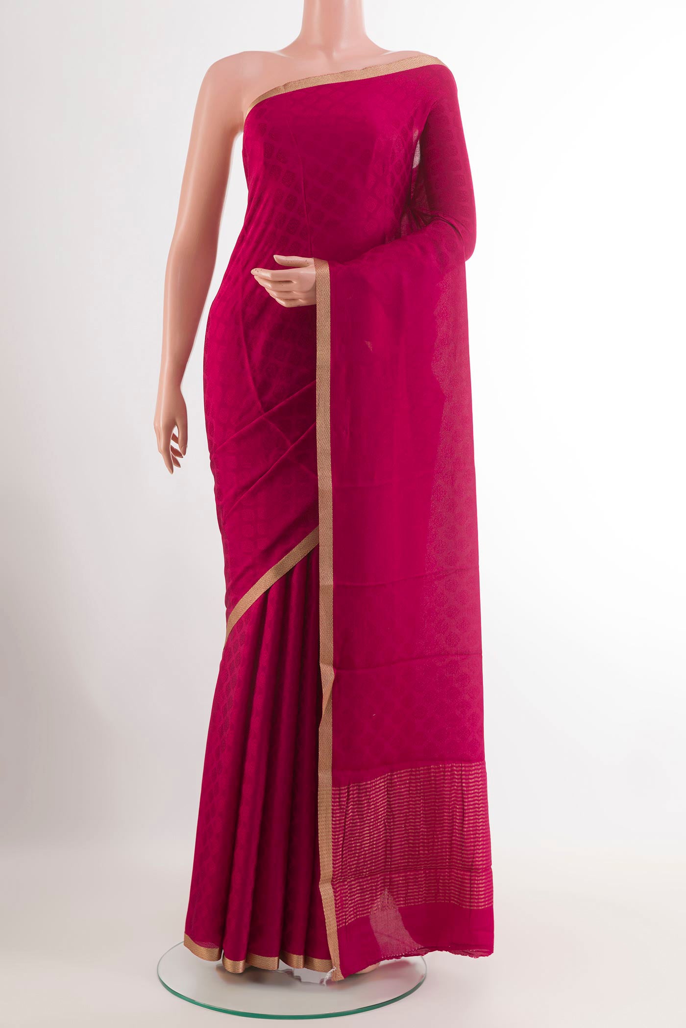 Pink Mysore Crepe Saree with Jacquard design on the body and Zari Border.  displayed on a mannequin