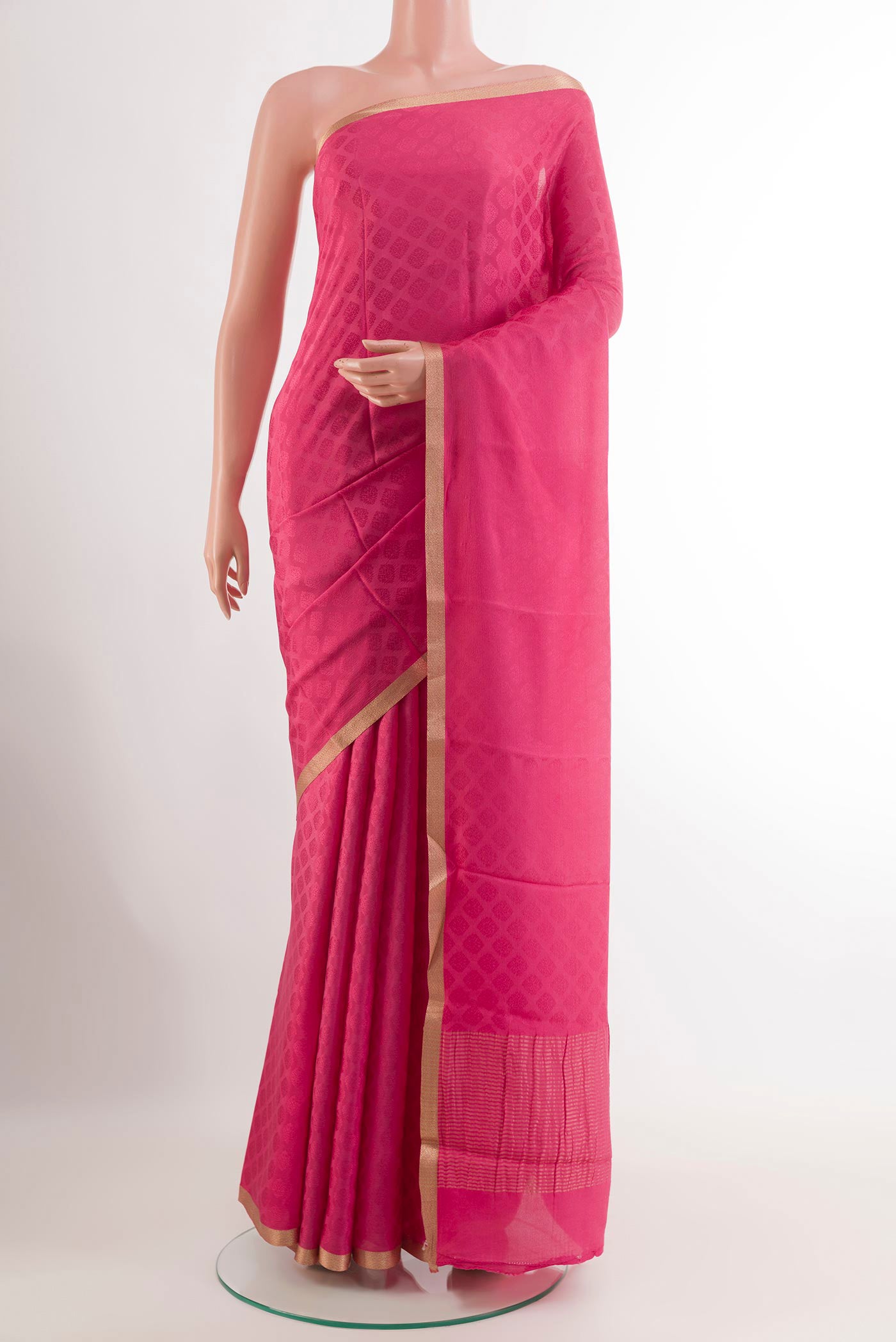 Pink Mysore Crepe Saree with Jacquard design on the body and Zari Border.  displayed on a mannequin