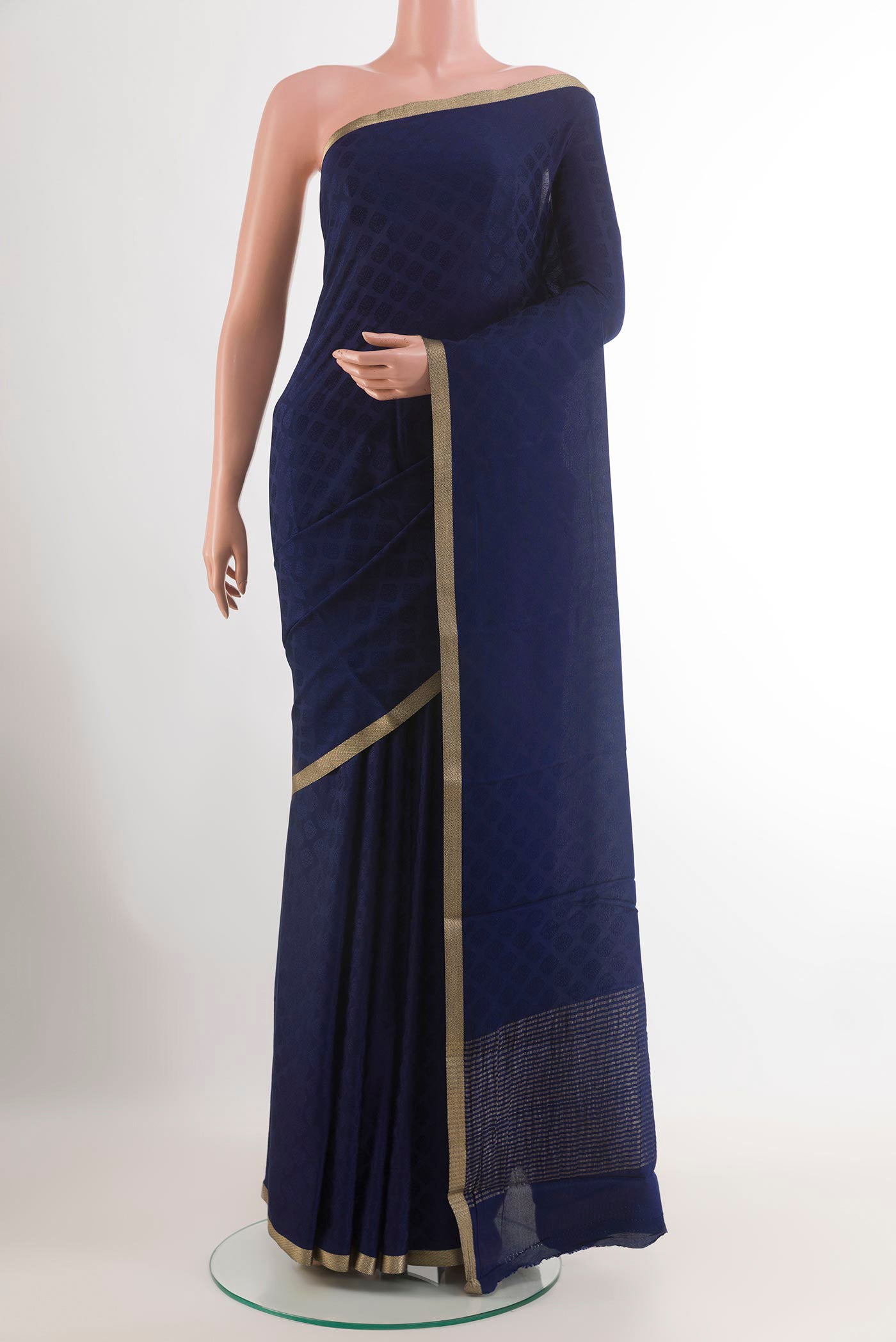 Dark Blue Mysore Crepe Saree with Jacquard design on the body and Zari Border.  displayed on a mannequin