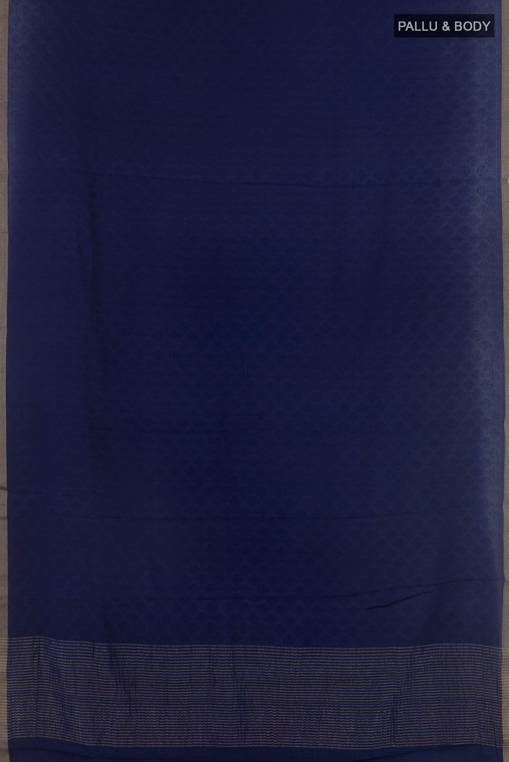 Flat view of Dark Blue Mysore Crepe Saree with Jacquard design on the body and Zari Border. 