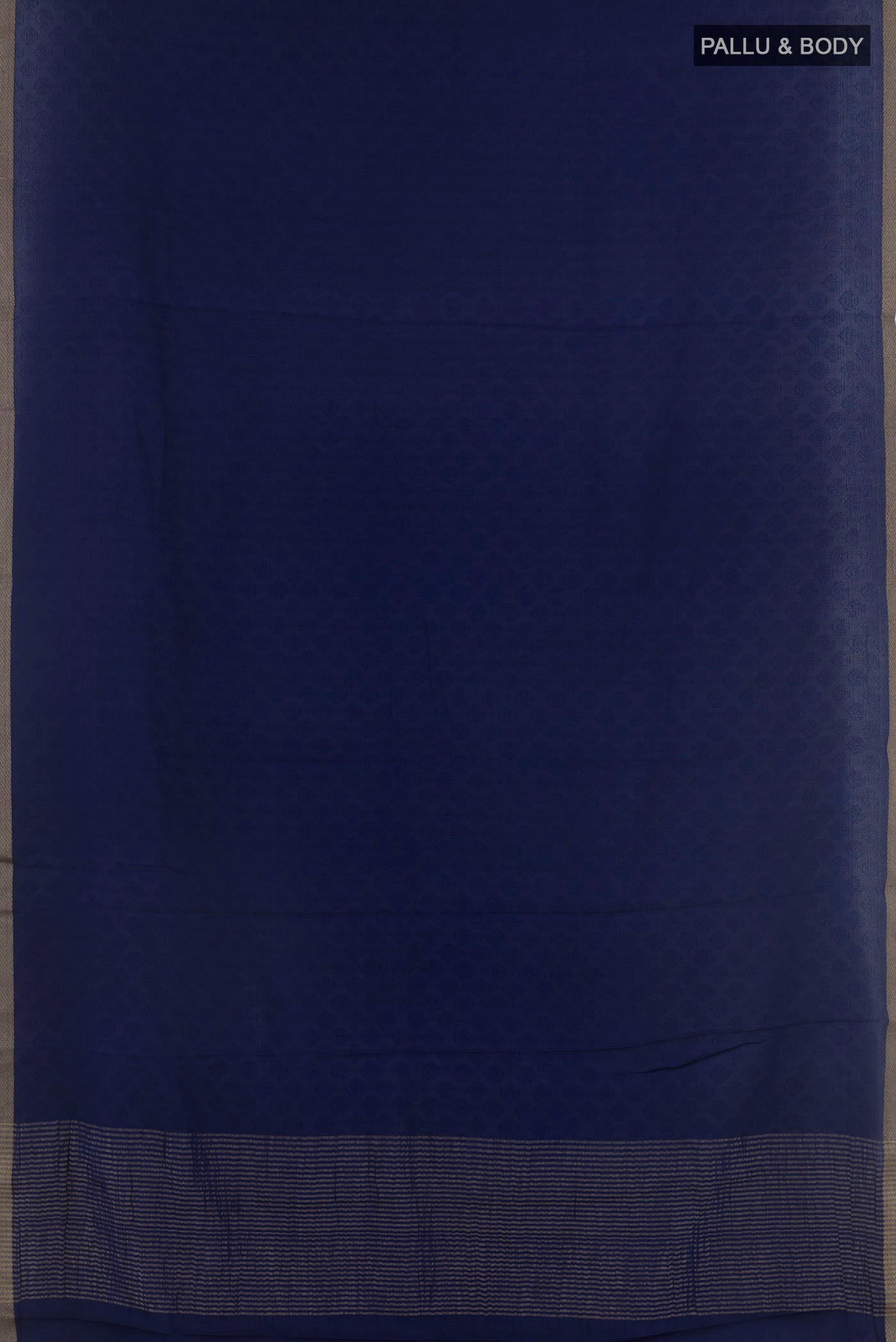 Flat view of Dark Blue Mysore Crepe Saree with Jacquard design on the body and Zari Border. 