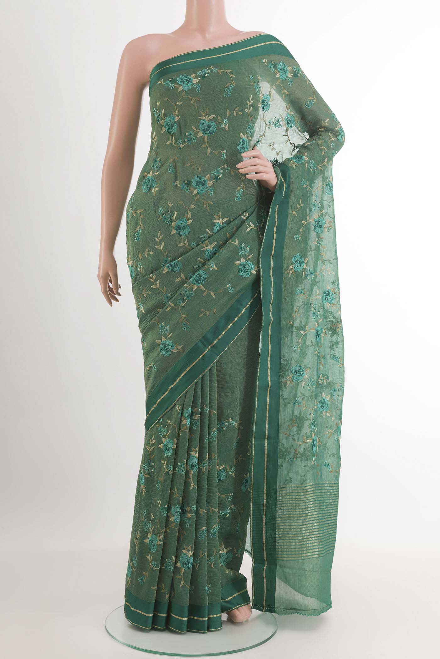 Green Mysore Georgette Saree with Thread Butta on the body and Zari Border.  displayed on a mannequin
