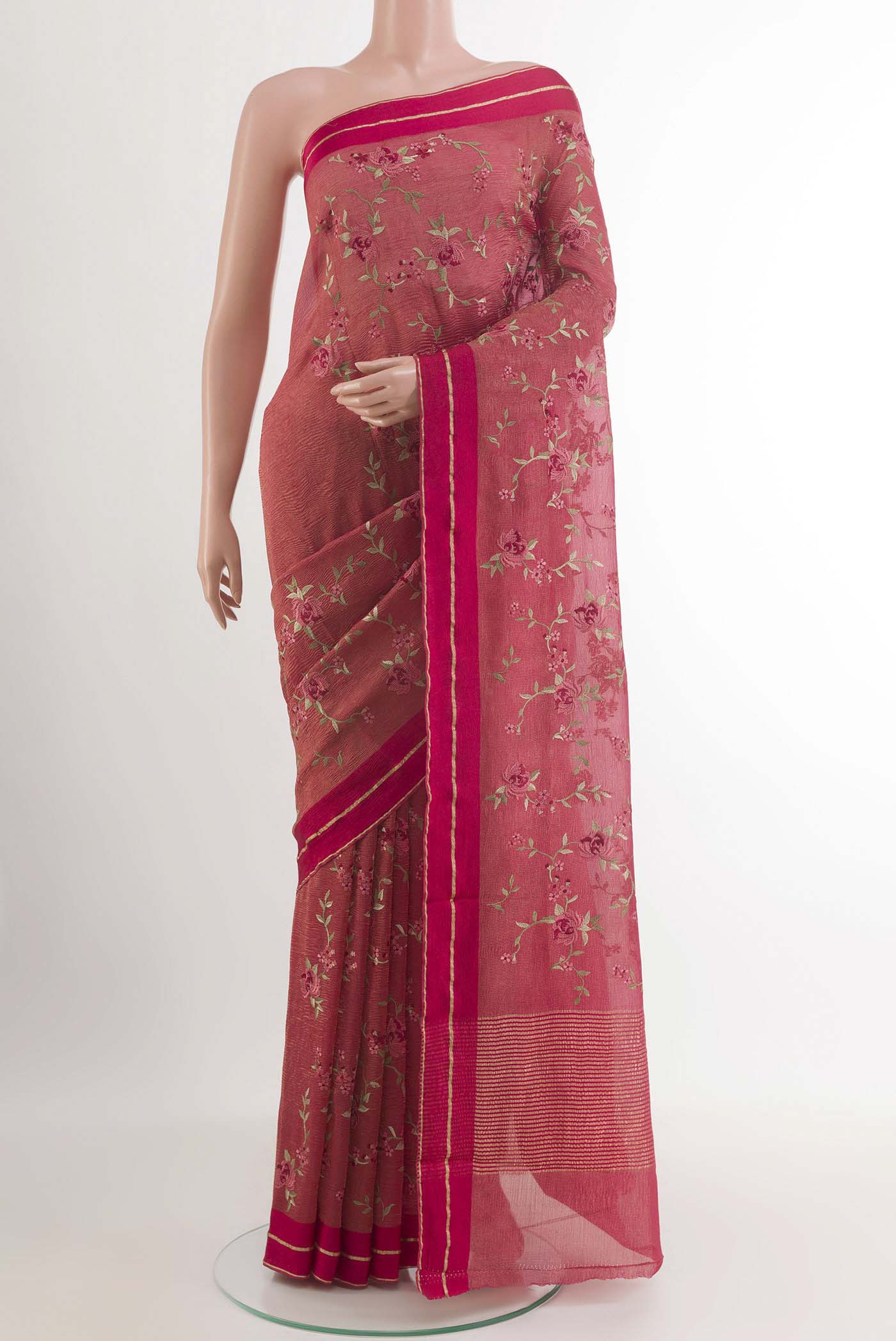 Pink Mysore Crepe Saree with Embroidery on the body and Zari Border.  displayed on a mannequin