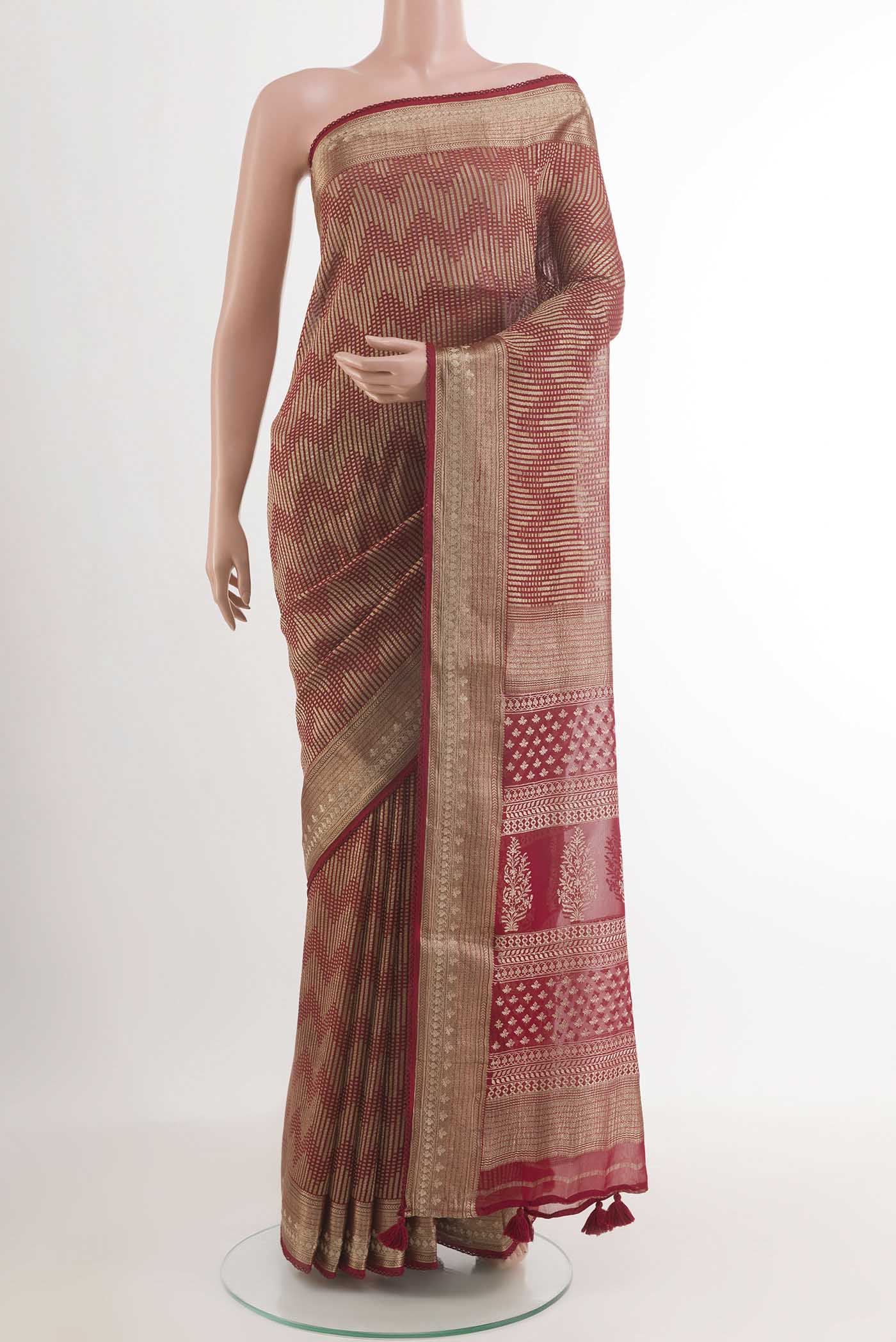 Red Mysore Crepe Saree with Zari Brocade on the body and Zari Border.  displayed on a mannequin