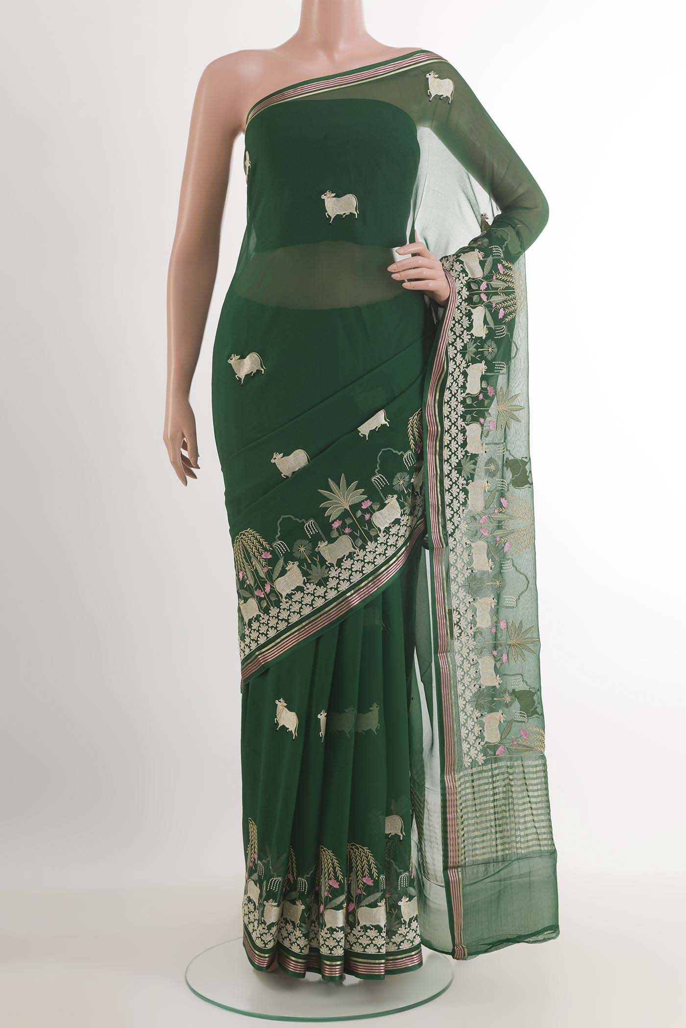 Bottle Green Mysore Chiffon Saree with Embroidery on the body and Zari Border.  displayed on a mannequin
