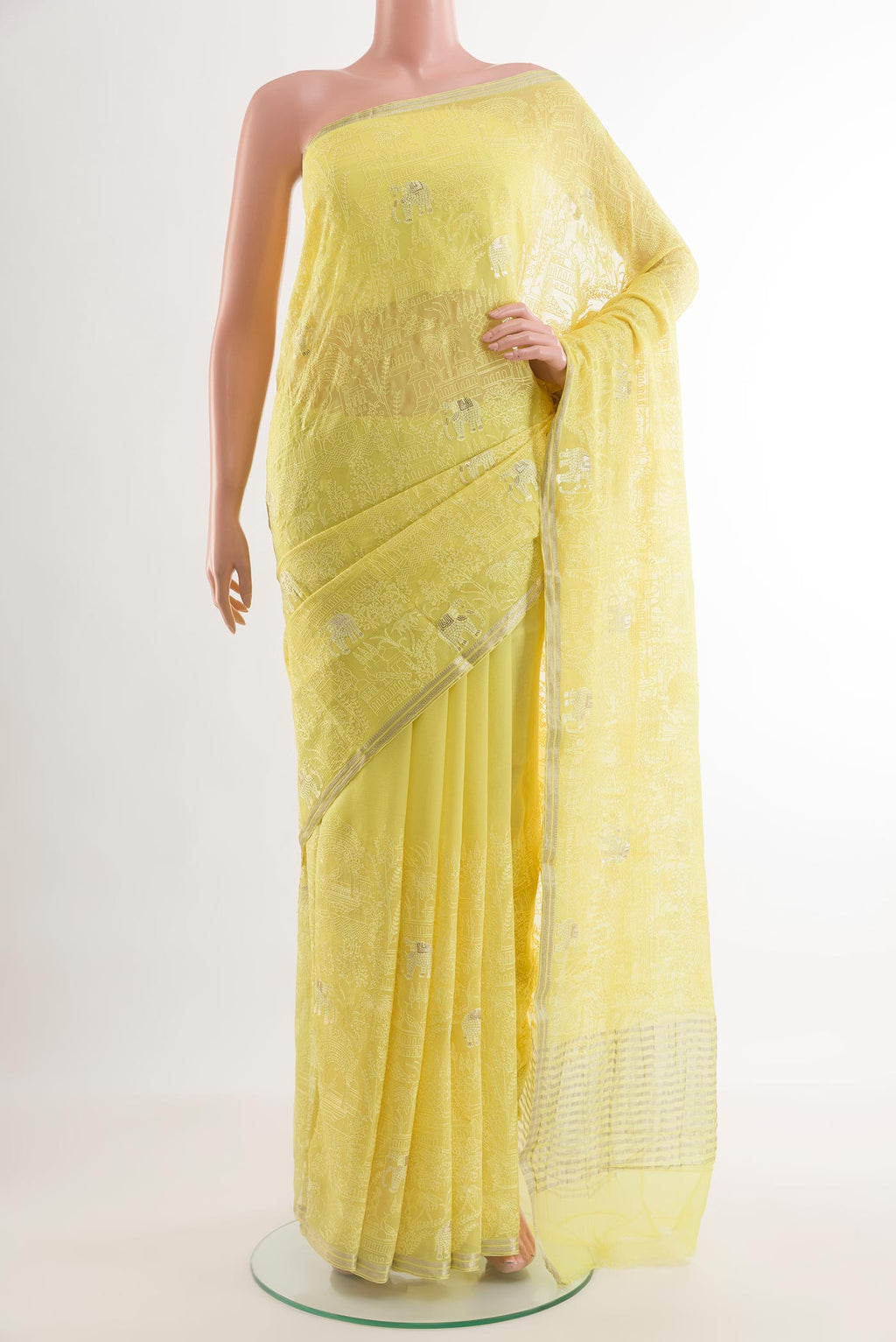 Lemon Yellow Mysore Chiffon Saree with Embroidery on the body and Zari Border.  displayed on a mannequin
