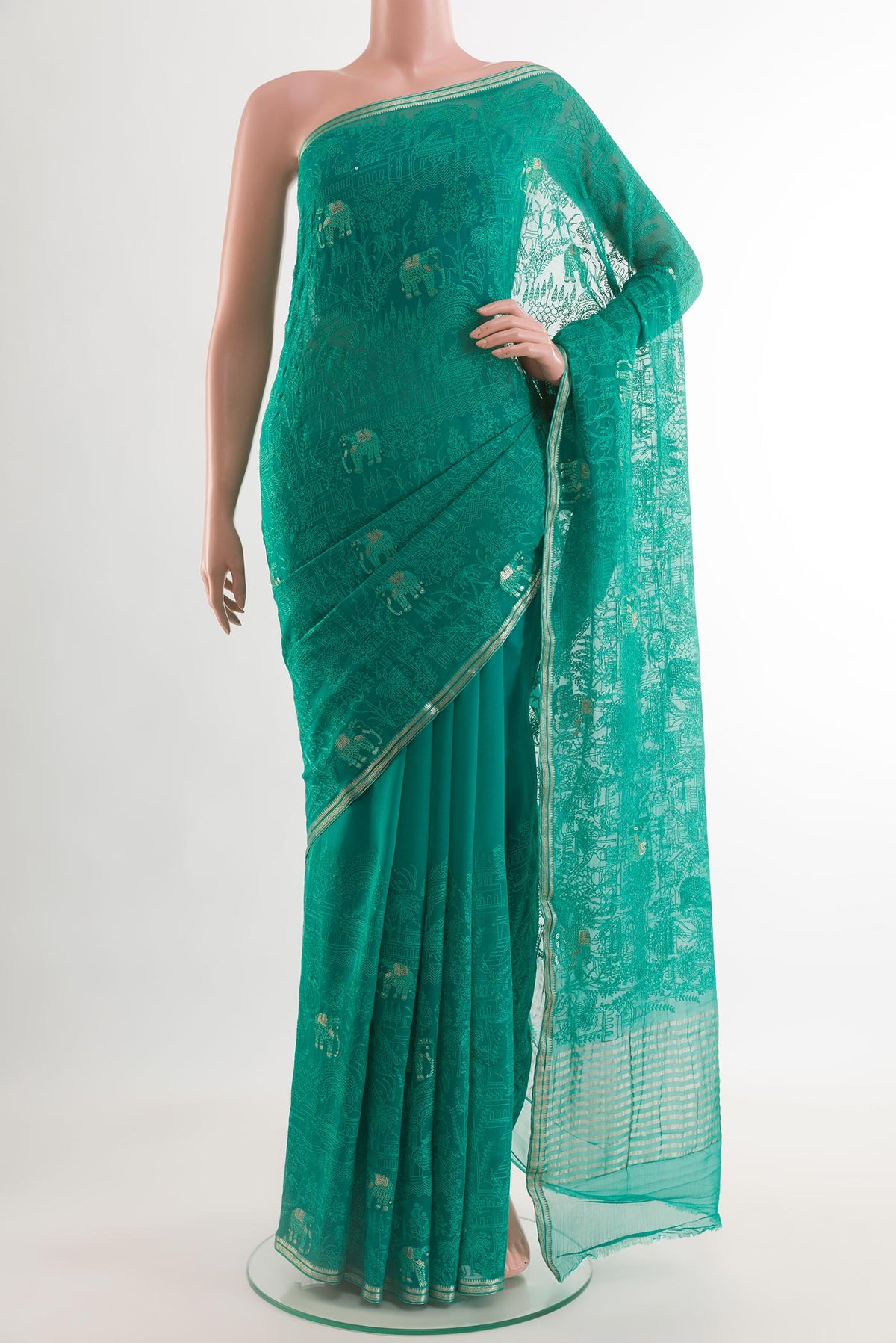 Sea Green Mysore Chiffon Saree with Embroidery on the body and Zari Border.  displayed on a mannequin