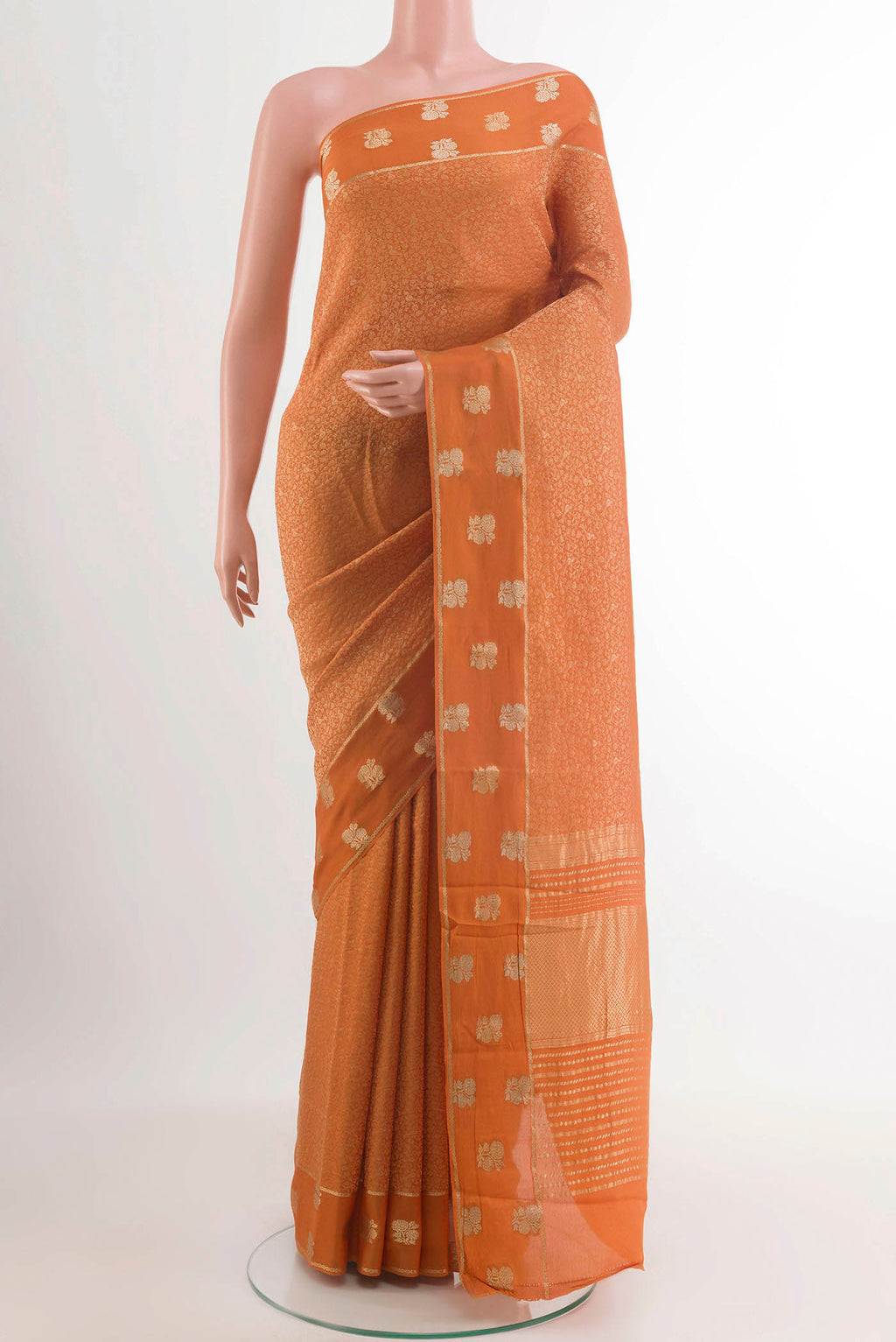 Orange Mysore Crepe Saree with Zari Brocade on the body and Zari Border.  displayed on a mannequin