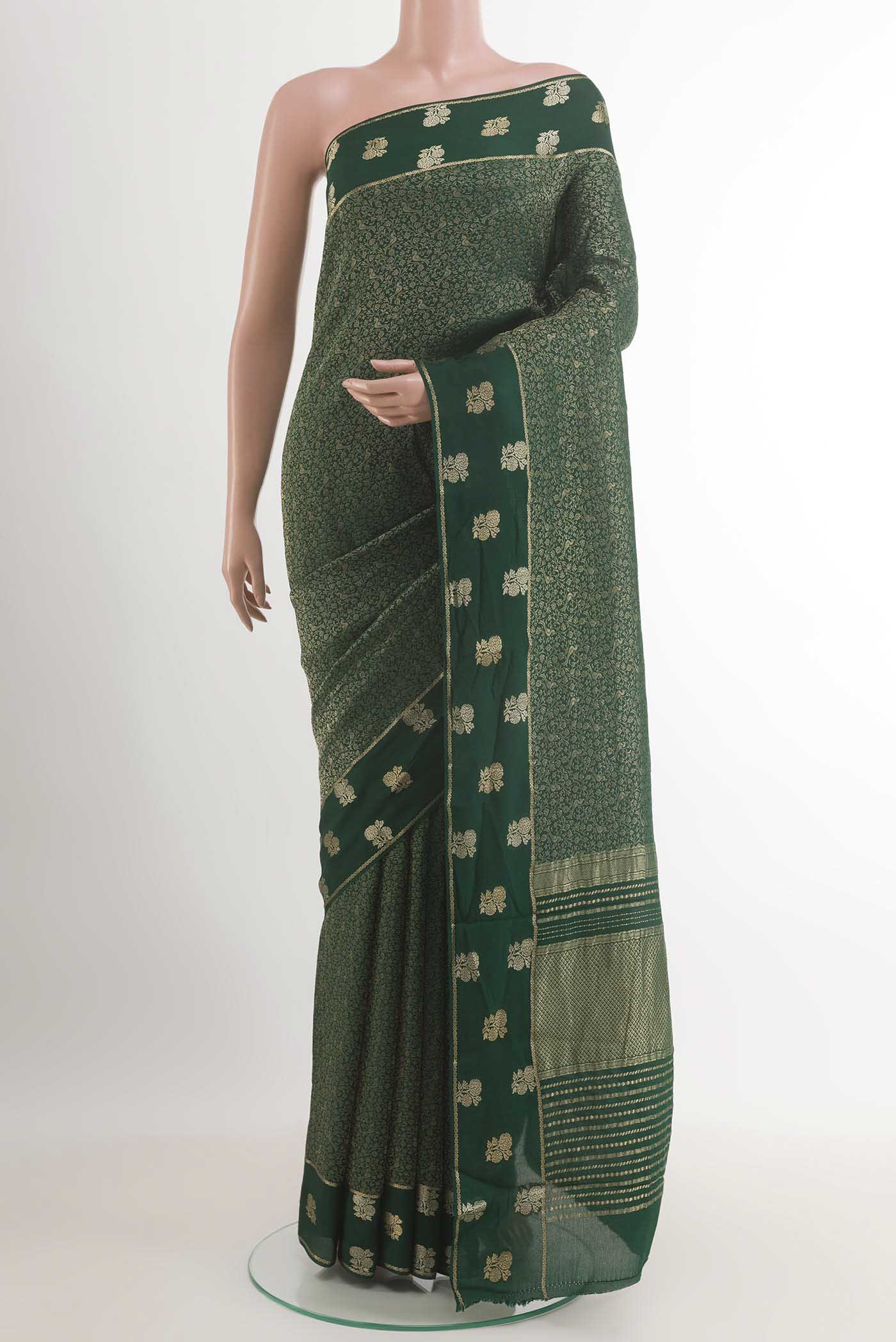 Green Mysore Crepe Saree with Zari Brocade on the body and Zari Border.  displayed on a mannequin