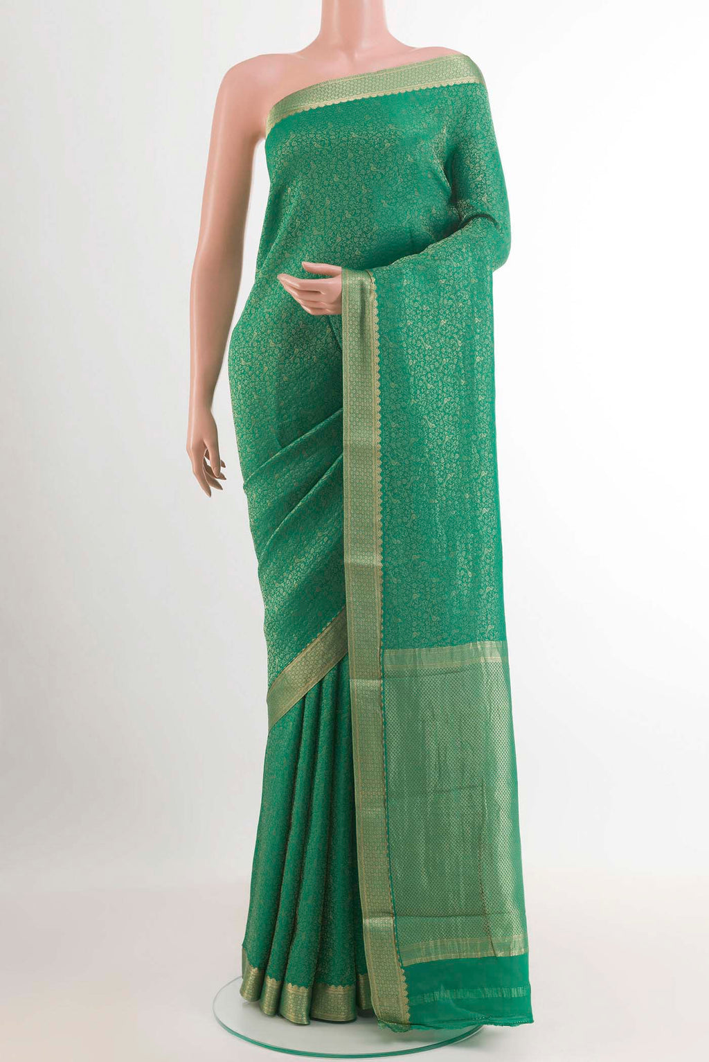 Green Mysore Crepe Saree with Zari Brocade on the body and Zari Border.  displayed on a mannequin
