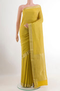 Yellow Mysore Crepe Saree with Zari Brocade on the body and Zari Border.  displayed on a mannequin