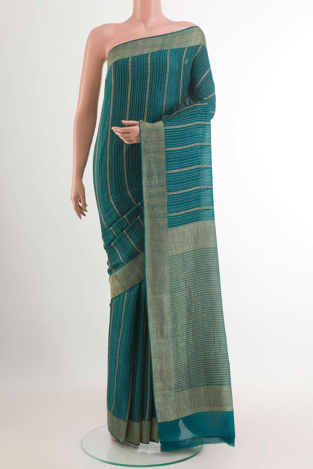 Teal Mysore Crepe Saree with Stripes on the body and Plain Border.  displayed on a mannequin