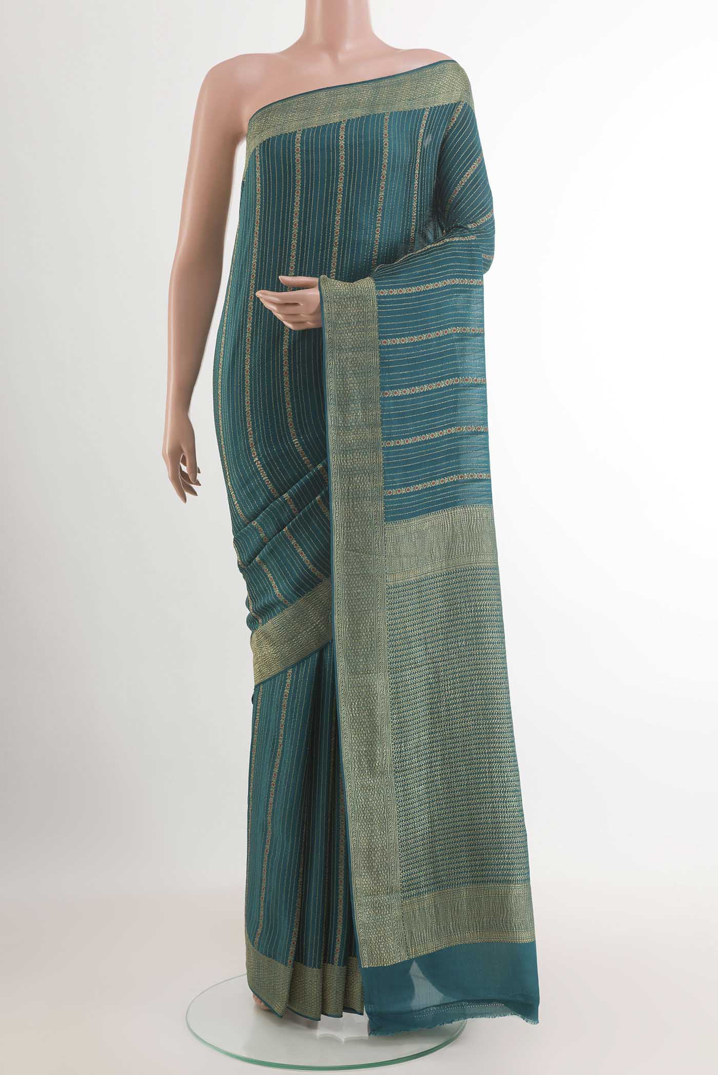 Teal Mysore Crepe Saree with Stripes on the body and Plain Border.  displayed on a mannequin