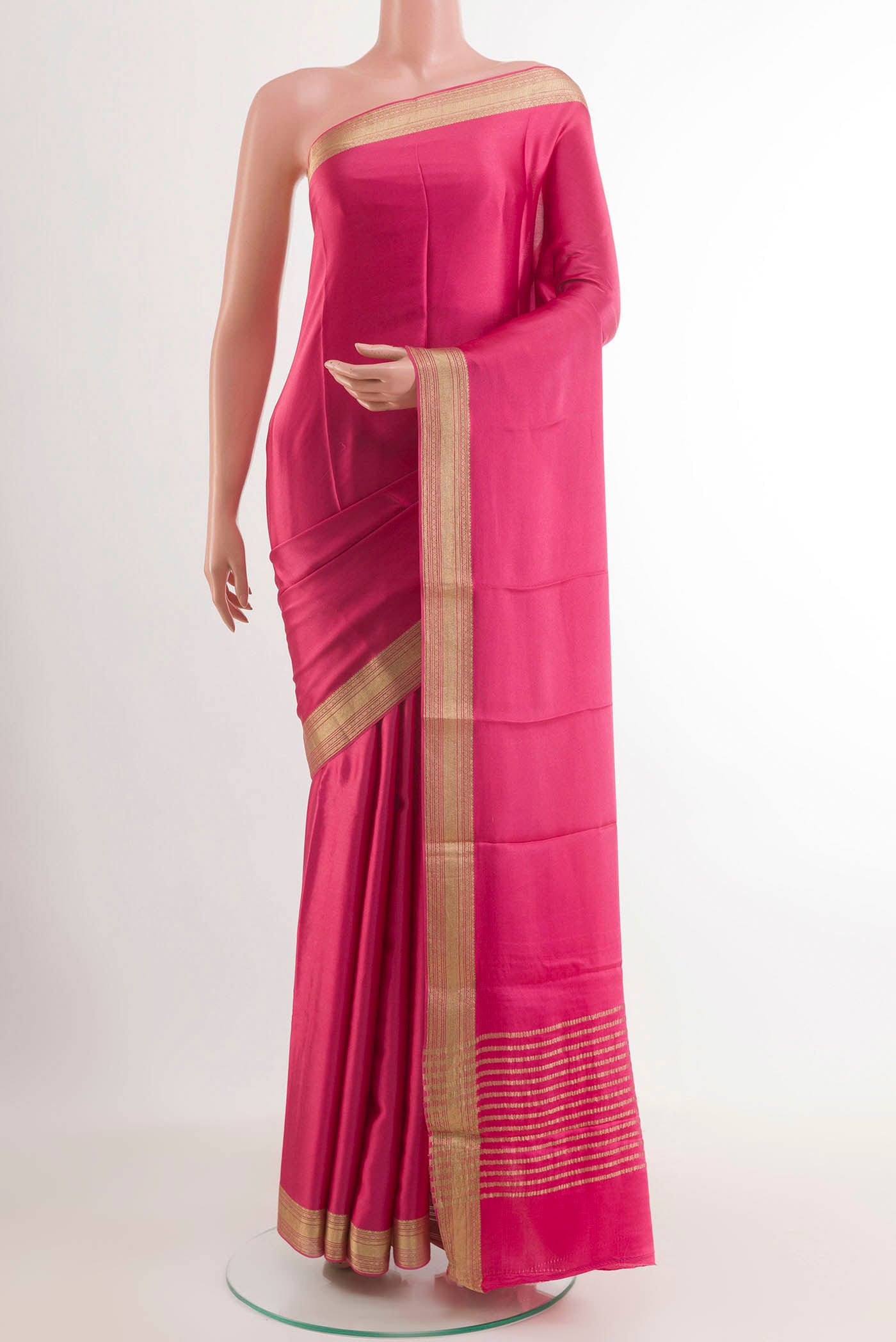 Pink Mysore Crepe Saree with Plain Body and Zari Border.  displayed on a mannequin