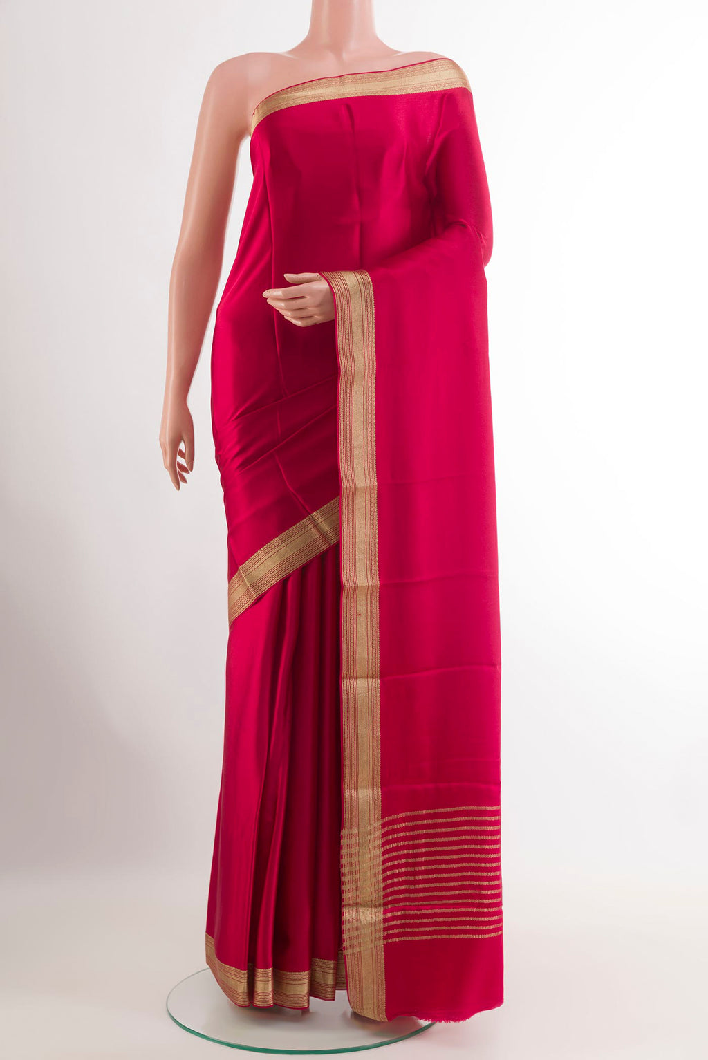 Pink Mysore Crepe Saree with Plain Body and Zari Border.  displayed on a mannequin