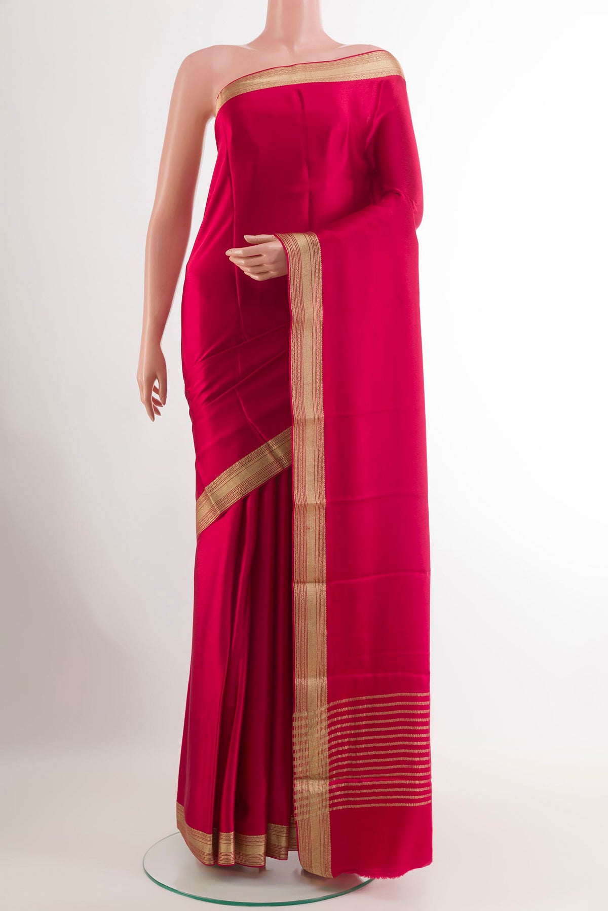 Pink Mysore Crepe Saree with Plain Body and Zari Border.  displayed on a mannequin