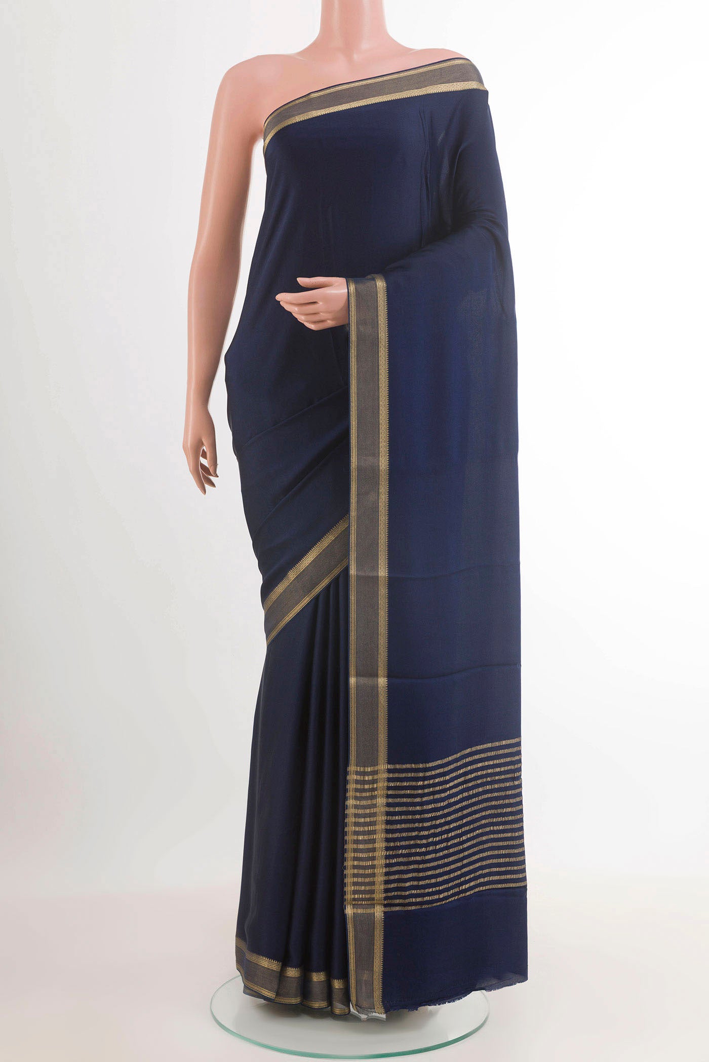 Blue Mysore Crepe Saree with Plain Body and Zari Border.  displayed on a mannequin