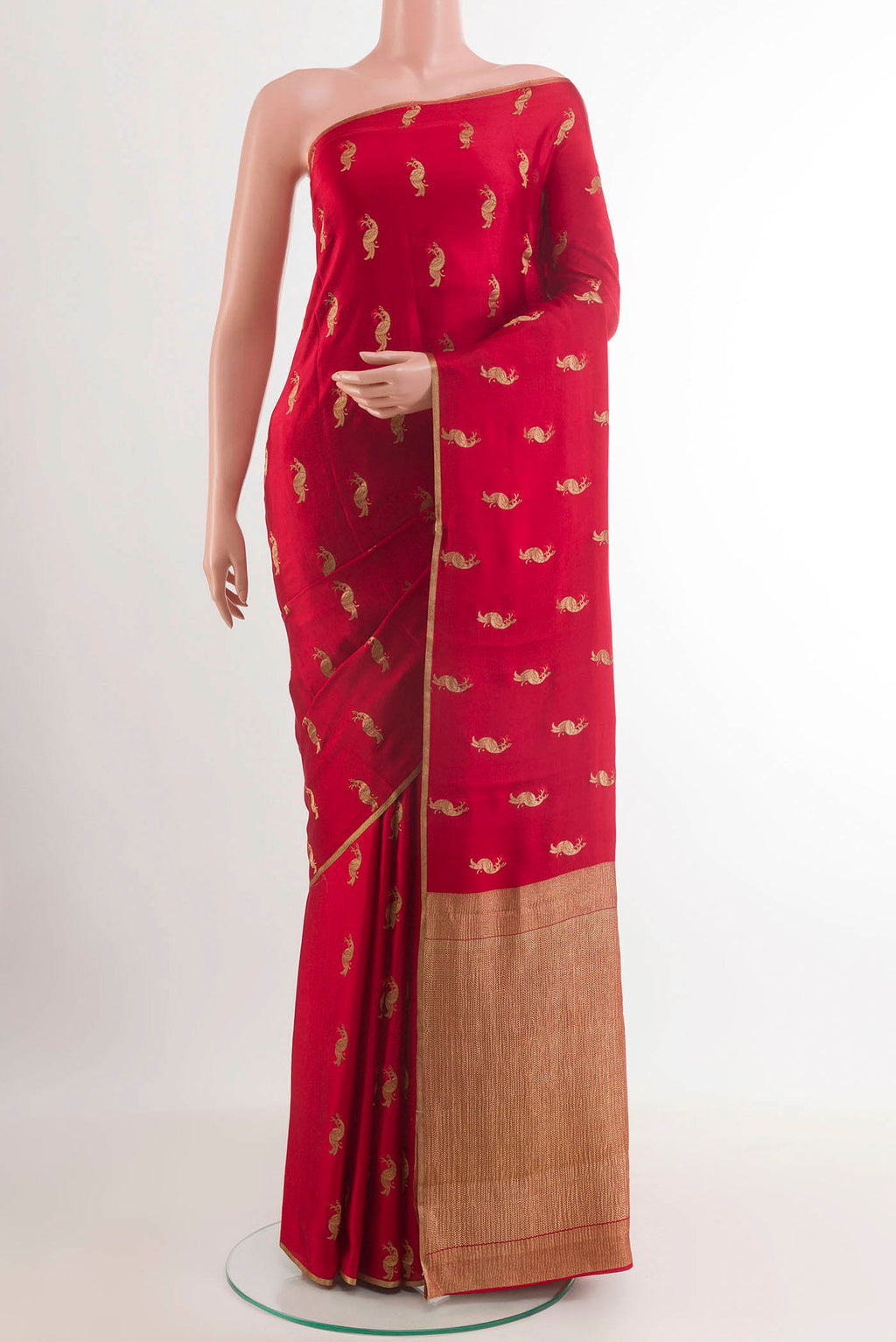 Red Mysore Crepe Saree with Zari Butta on the body and Zari Border.  displayed on a mannequin