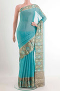 Blue Mysore Georgette Saree with Plain Body and Zari Border.  displayed on a mannequin