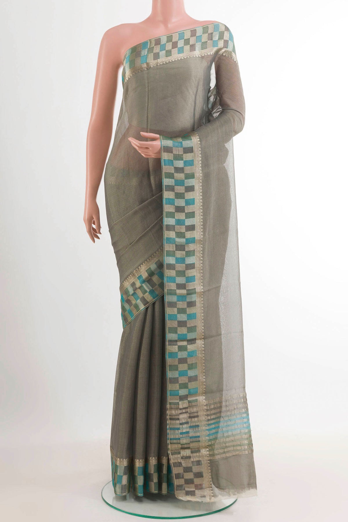Grey Mysore Crepe Saree with Plain Body and Zari Border.  displayed on a mannequin