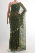Green Mysore Chiffon Saree with Zari Butta on the body and Zari Border.  displayed on a mannequin