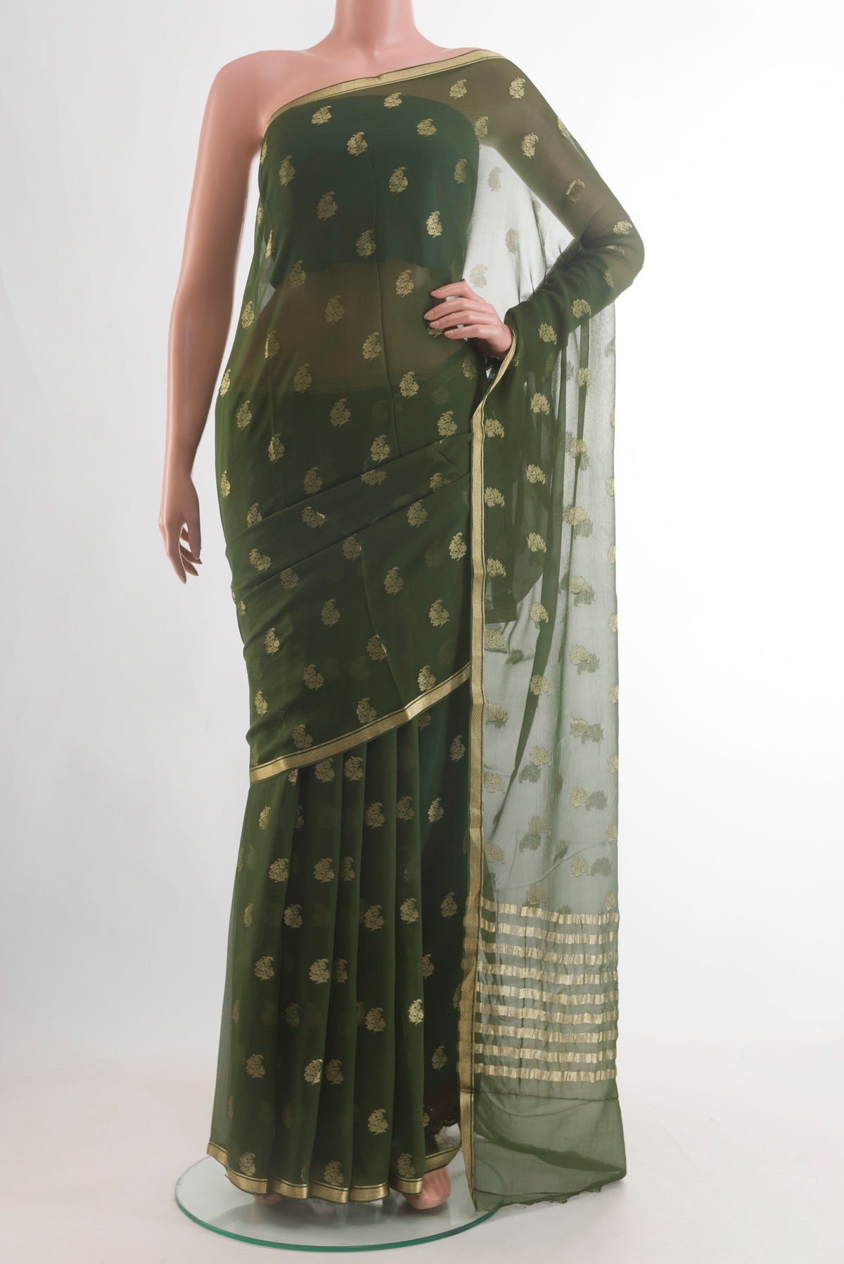 Green Mysore Chiffon Saree with Zari Butta on the body and Zari Border.  displayed on a mannequin