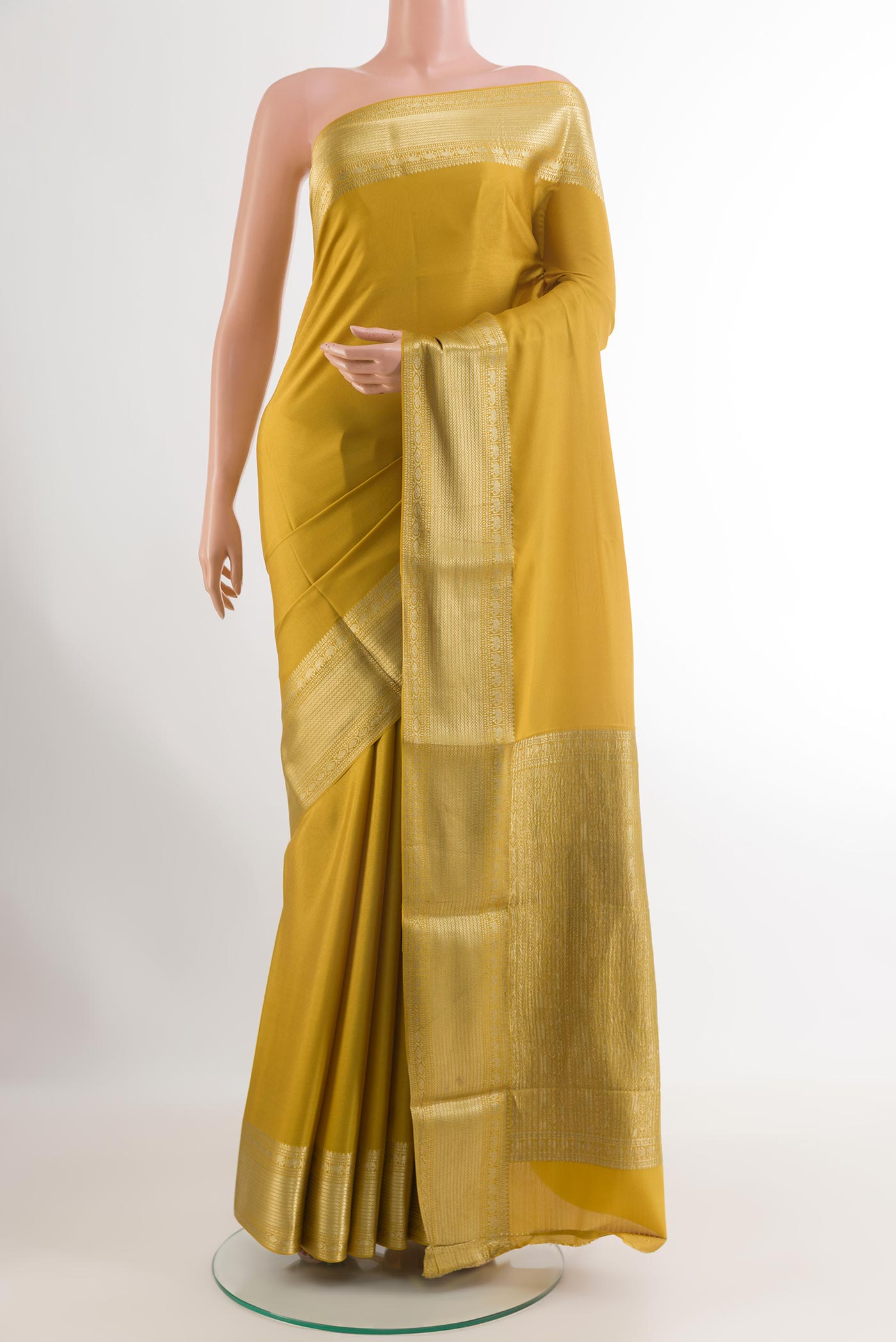 Yellow Mysore Crepe Saree with Plain Body and Zari Border.  displayed on a mannequin