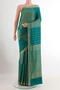 Sea Green Mysore Crepe Saree with Zari Butta on the body and Zari Border.  displayed on a mannequin
