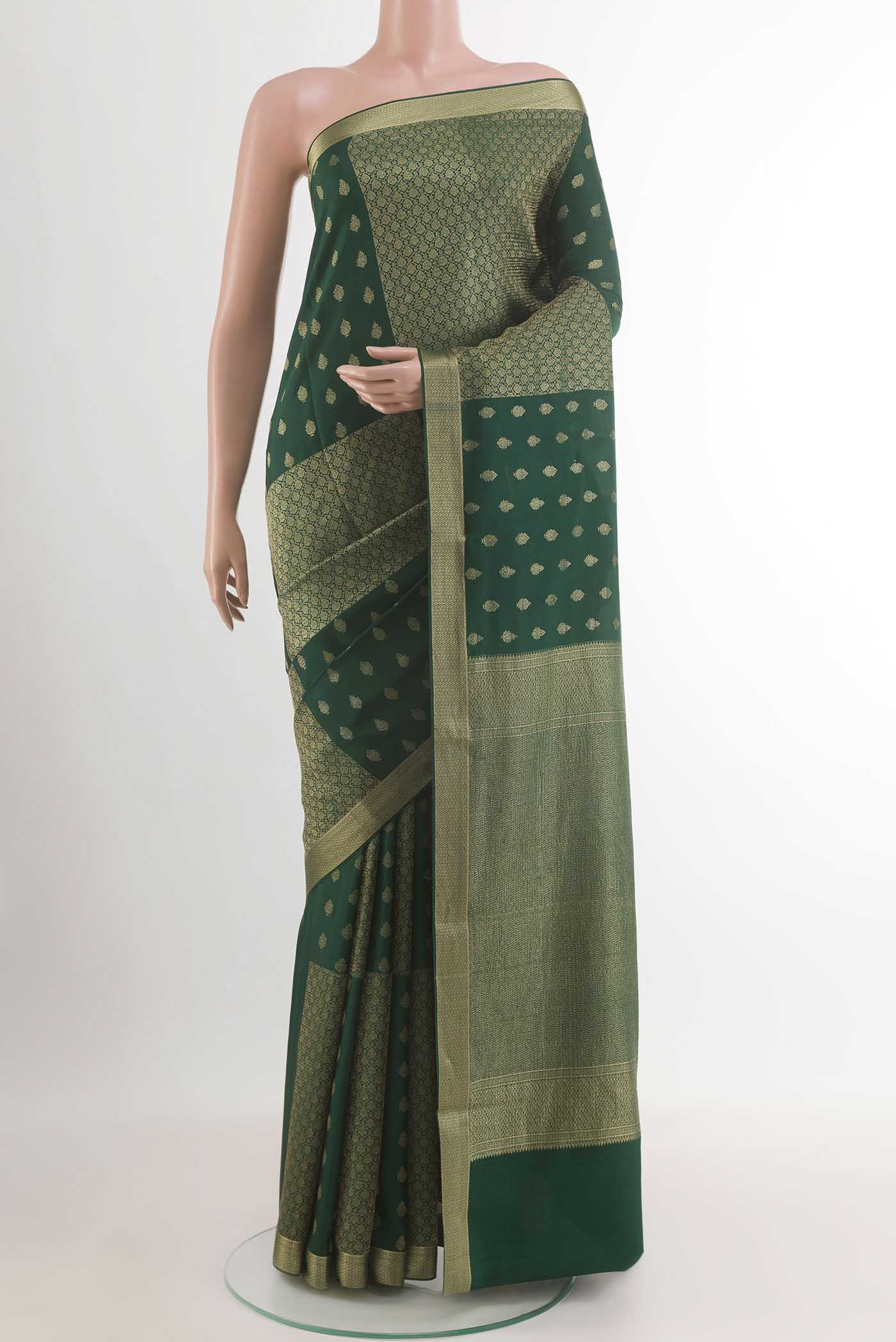 Green Mysore Crepe Saree with Zari Butta on the body and Zari Border.  displayed on a mannequin