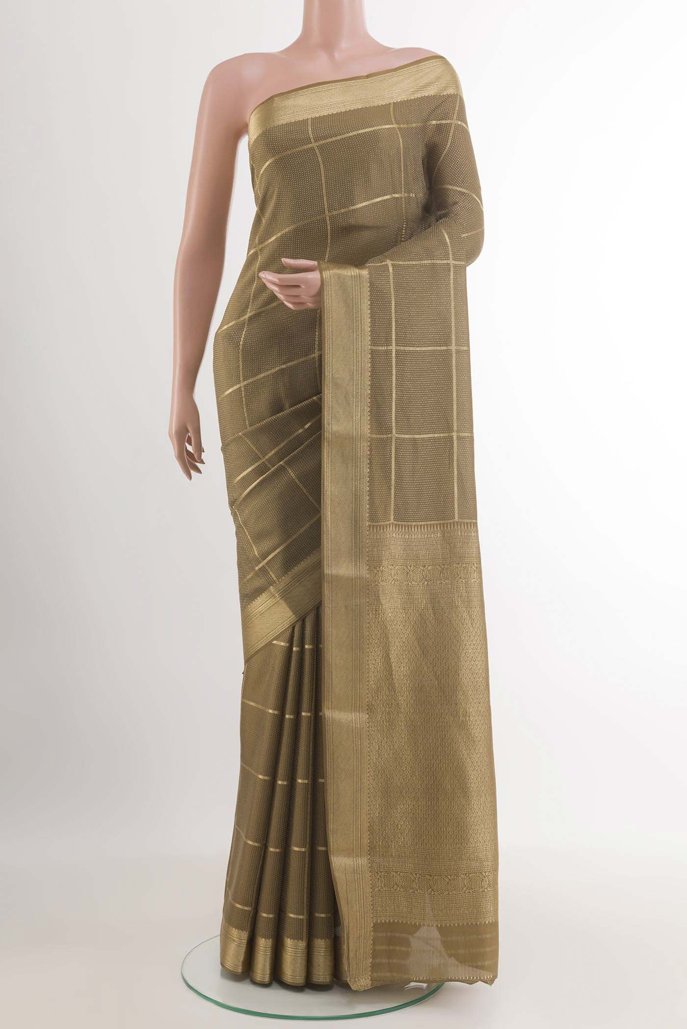 Golden Mysore Crepe Saree with Zari Brocade on the body and Zari Border.  displayed on a mannequin