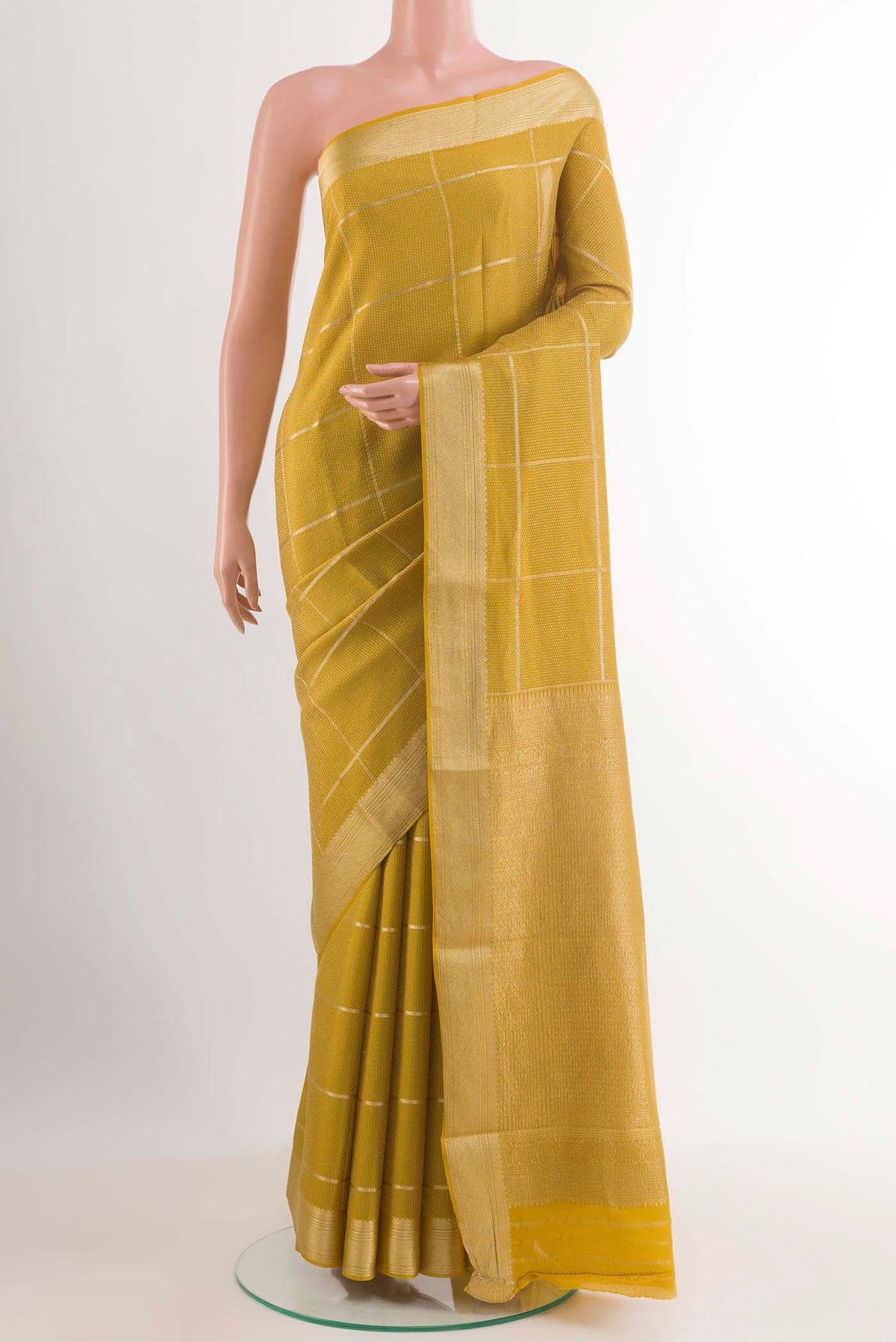 Yellow Mysore Crepe Saree with Zari Brocade on the body and Zari Border.  displayed on a mannequin
