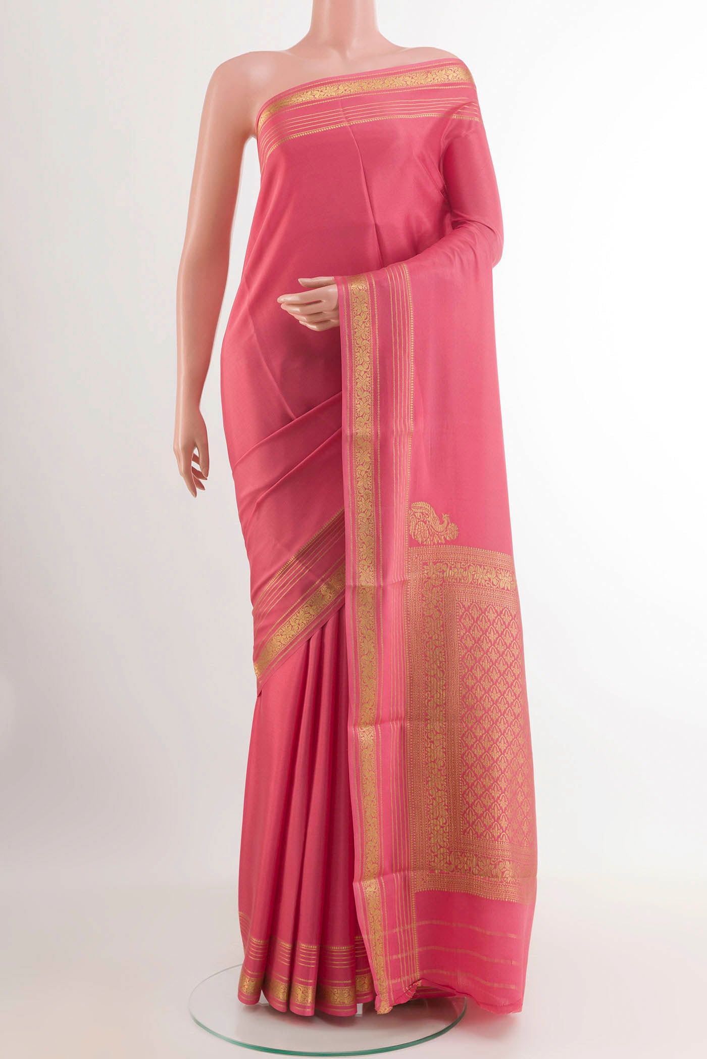 Pink Mysore Crepe Saree with Plain Body and Zari Border.  displayed on a mannequin