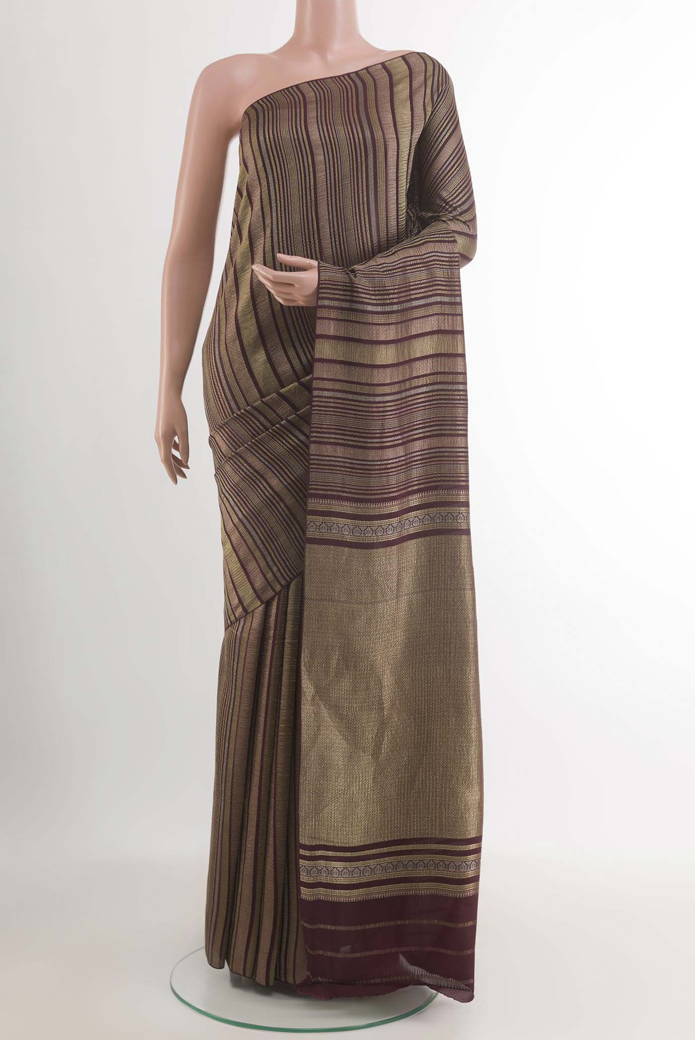 Brown Mysore Crepe Saree with Stripes on the body and Zari Border.  displayed on a mannequin