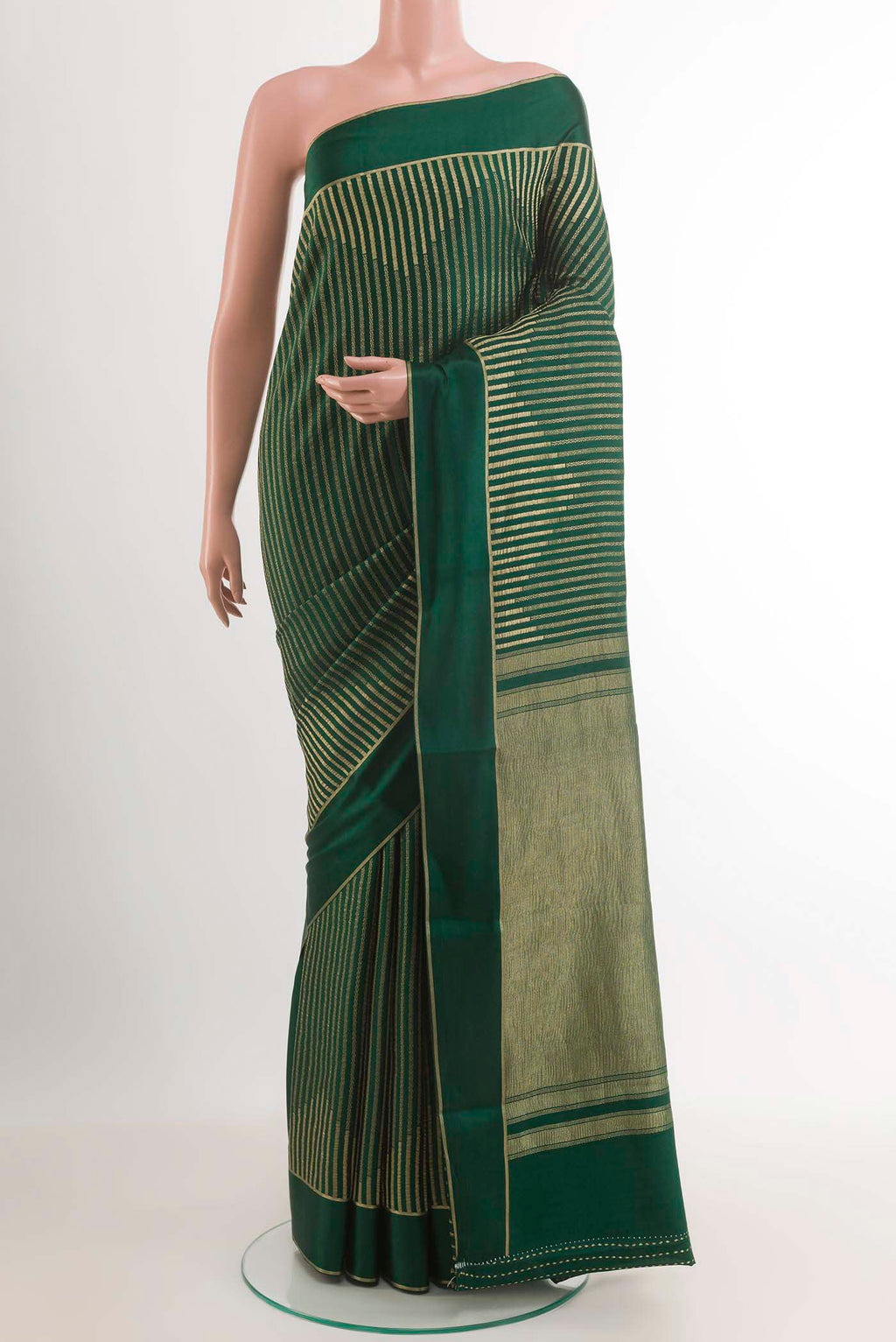 Bottle Green Mysore Crepe Saree with Stripes on the body and Zari Border.  displayed on a mannequin