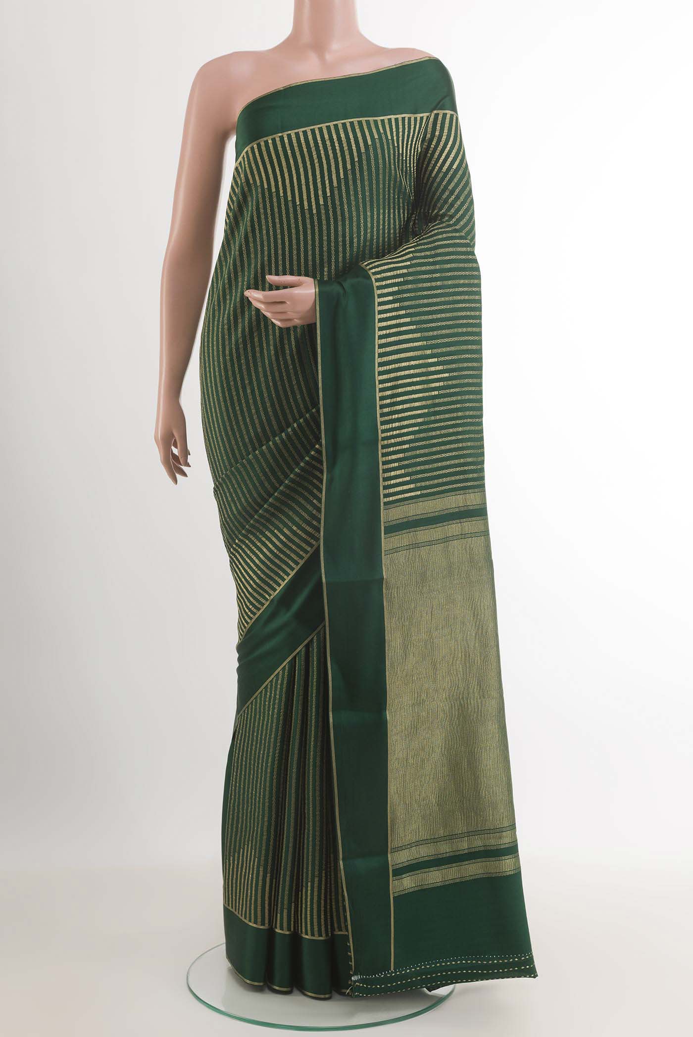 Bottle Green Mysore Crepe Saree with Stripes on the body and Zari Border.  displayed on a mannequin