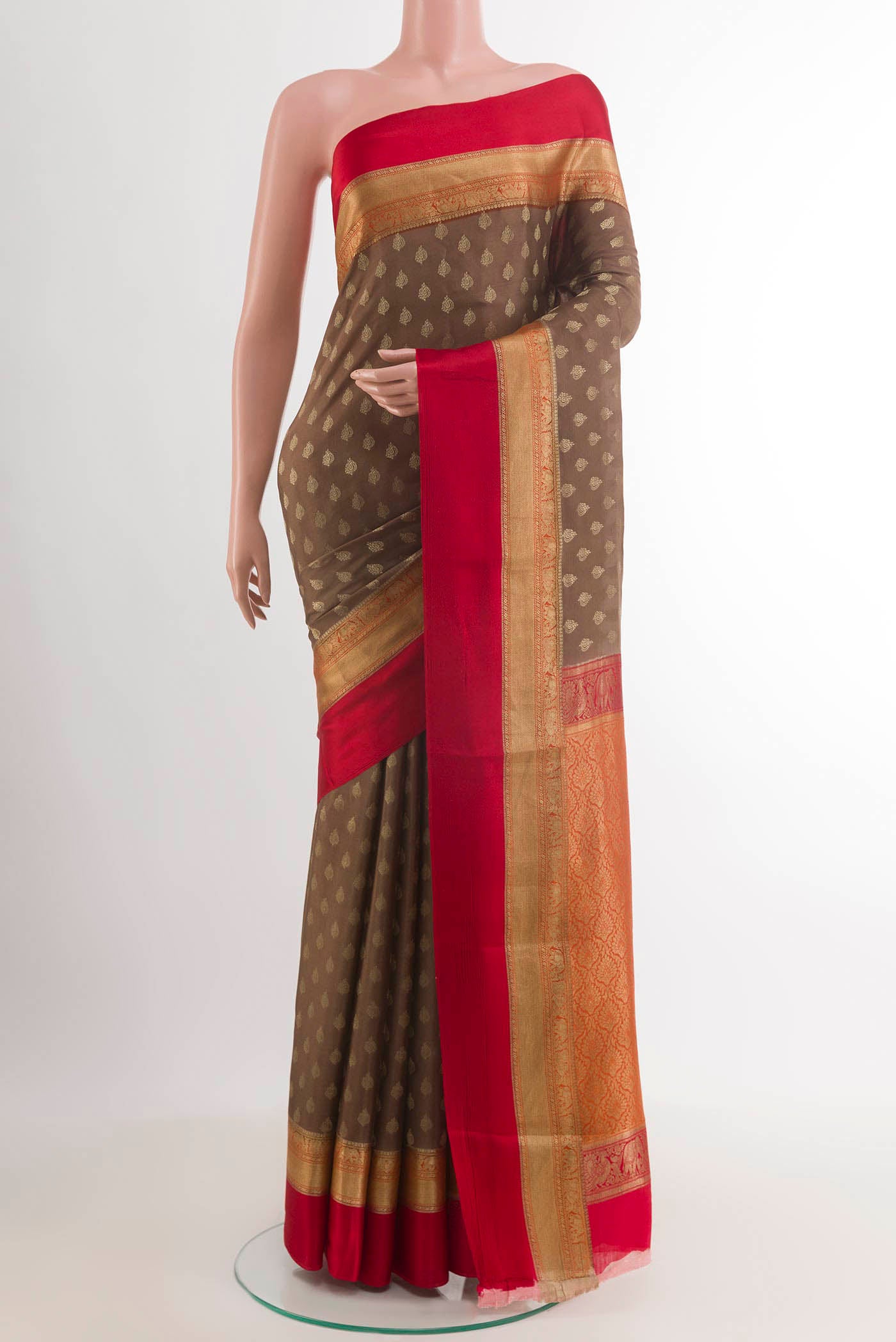 Brown Mysore Crepe Saree with Zari Butta on the body and Zari Border.  displayed on a mannequin