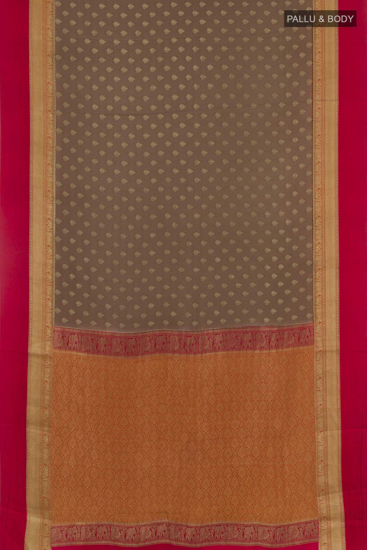 Flat view of Brown Mysore Crepe Saree with Zari Butta on the body and Zari Border. 