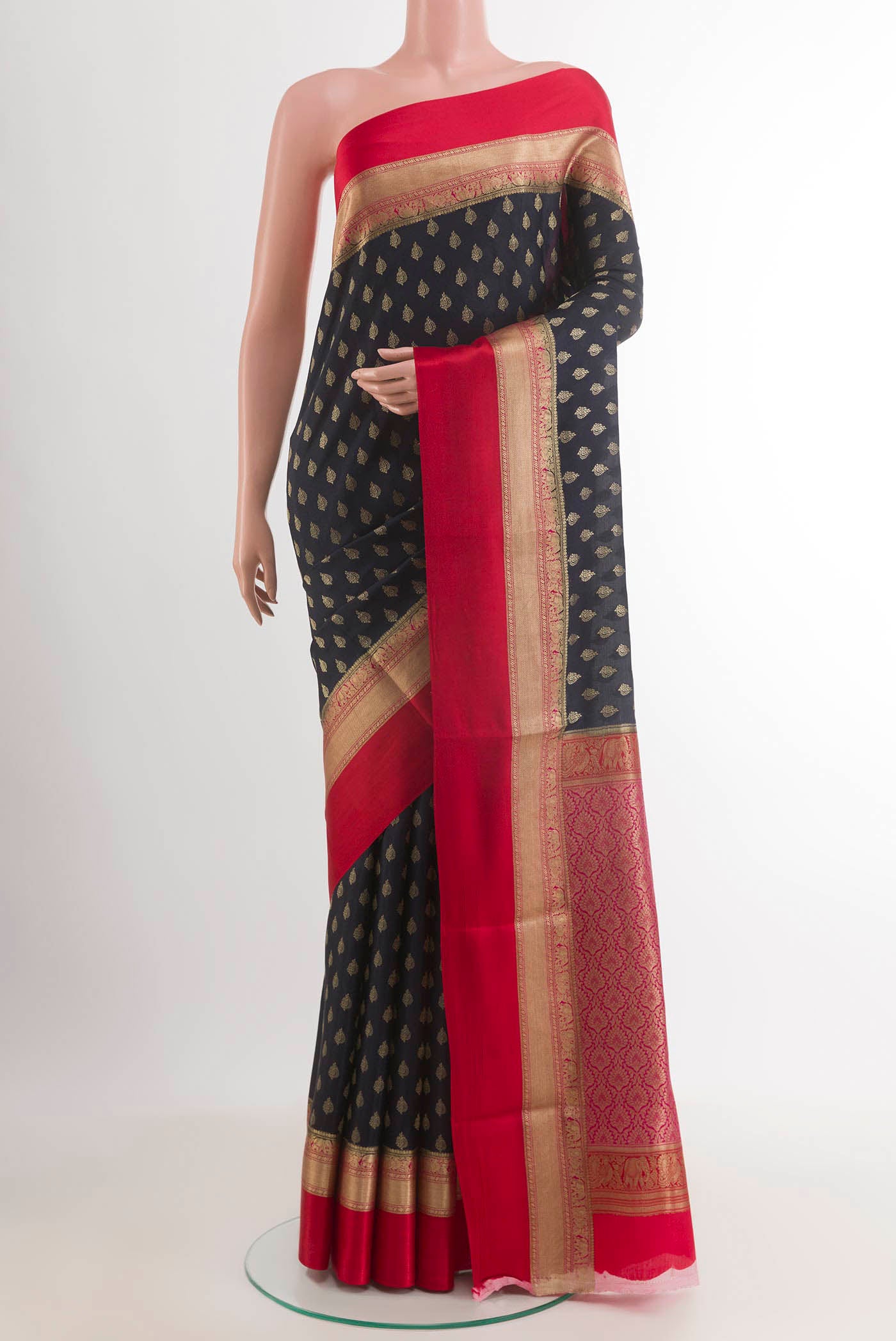 Dark Blue Mysore Crepe Saree with Zari Butta on the body and Zari Border.  displayed on a mannequin