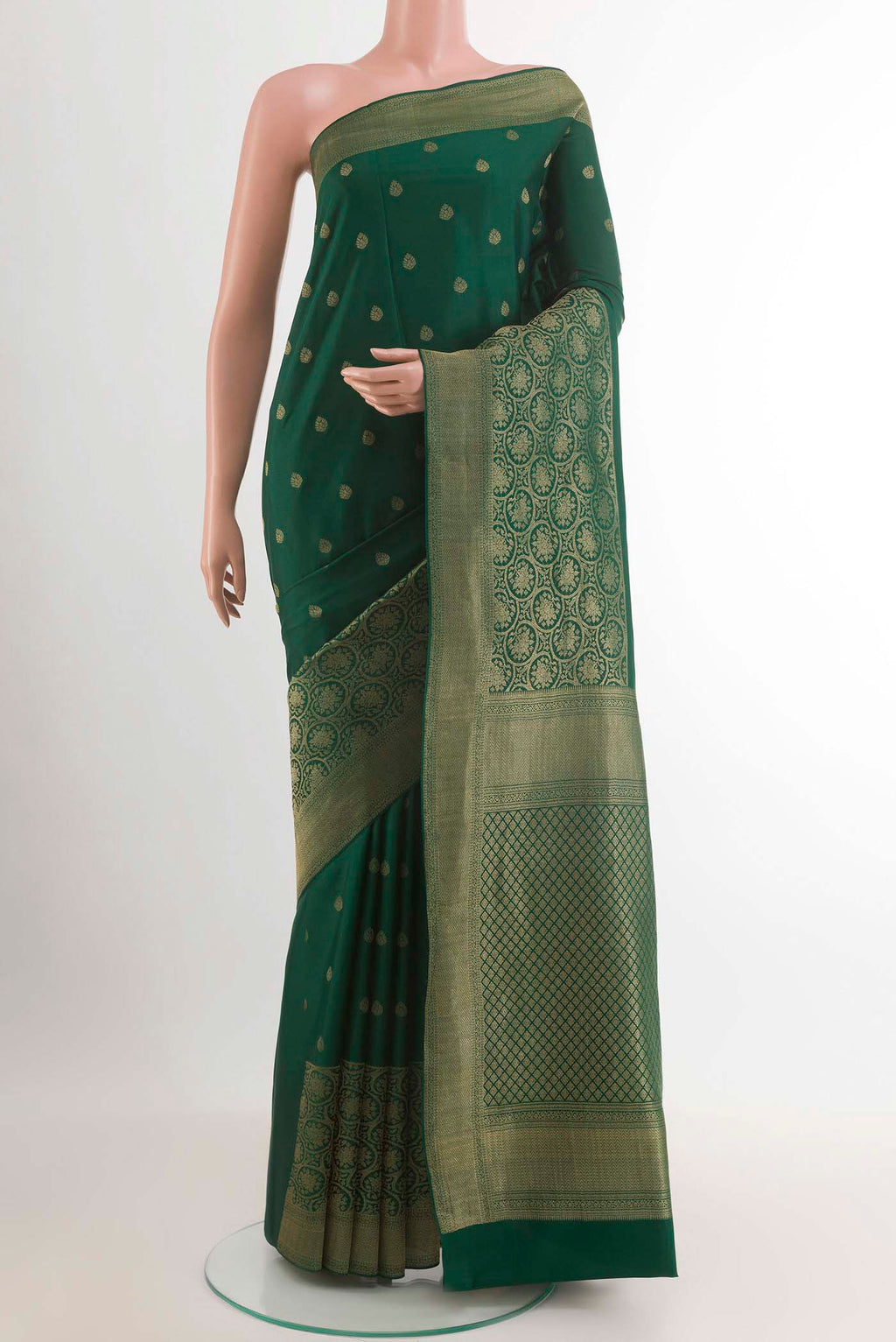 Green Mysore Crepe Saree with Zari Butta on the body and Zari Border.  displayed on a mannequin