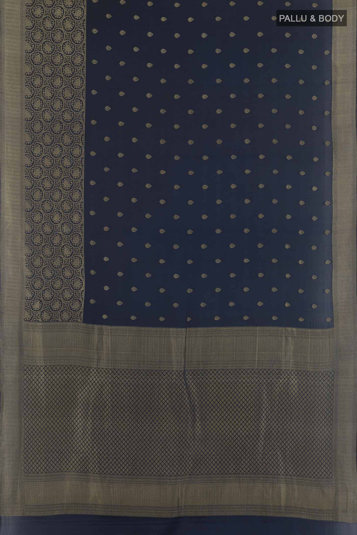 Flat view of Dark Blue Mysore Crepe Saree with Zari Butta on the body and Zari Border. 