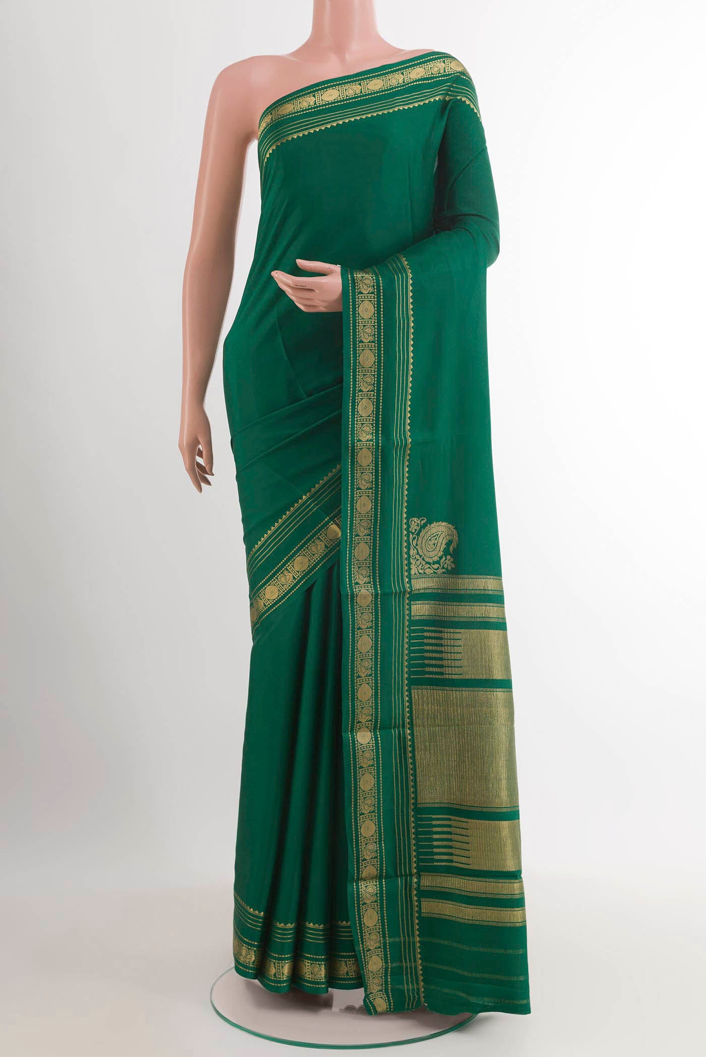 Green Mysore Crepe Saree with Plain Body and Zari Border.  displayed on a mannequin