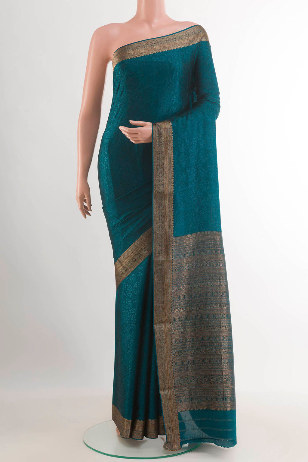 Blue Mysore Crepe Saree with Jacquard design on the body and Zari Border.  displayed on a mannequin