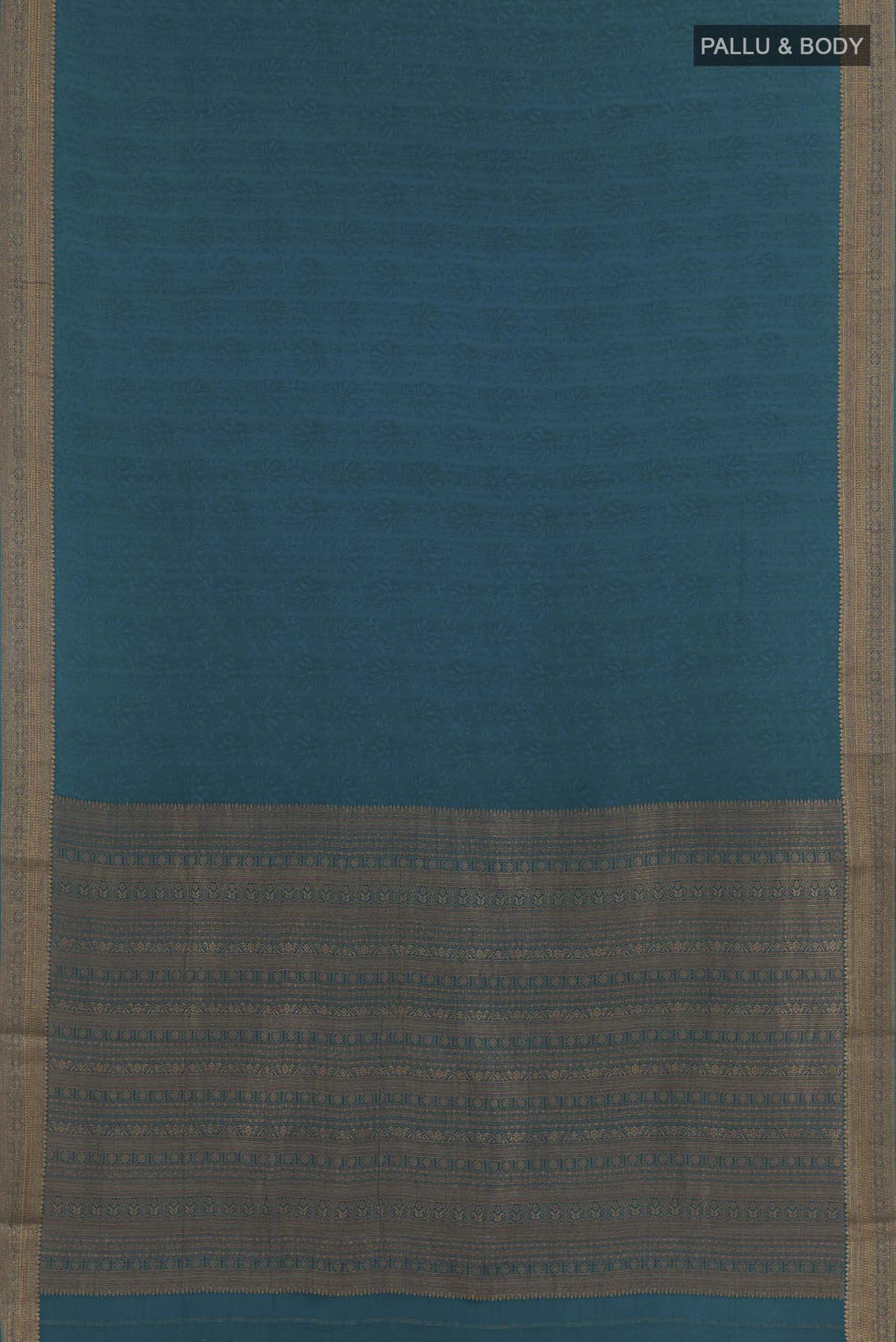 Flat view of Blue Mysore Crepe Saree with Jacquard design on the body and Zari Border. 