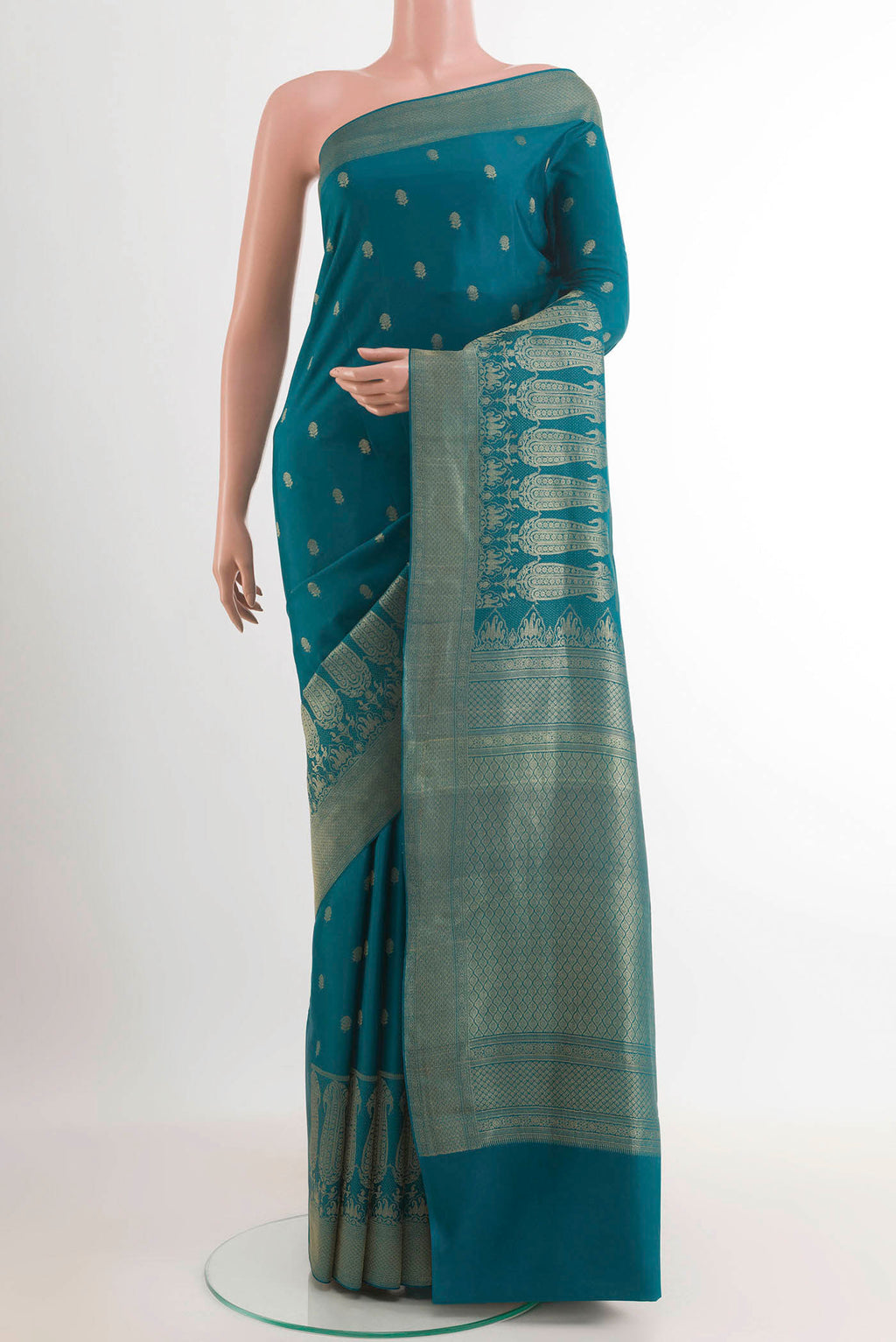 Teal Mysore Crepe Saree with Zari Butta on the body and Zari Border.  displayed on a mannequin