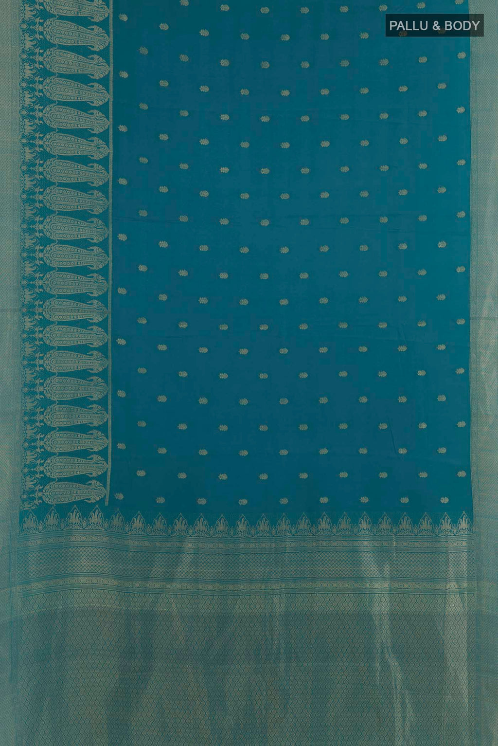 Flat view of Teal Mysore Crepe Saree with Zari Butta on the body and Zari Border. 