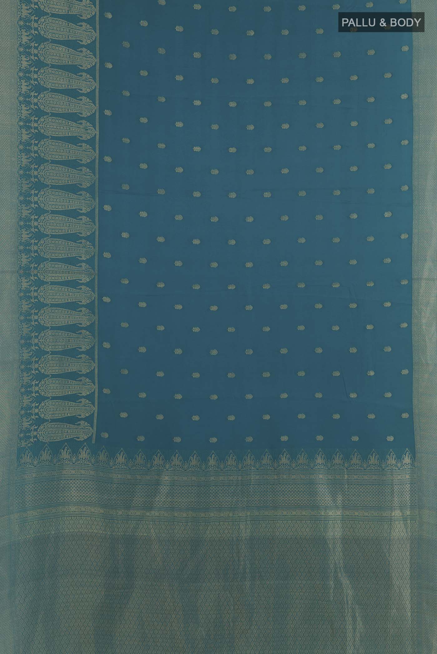 Flat view of Teal Mysore Crepe Saree with Zari Butta on the body and Zari Border. 