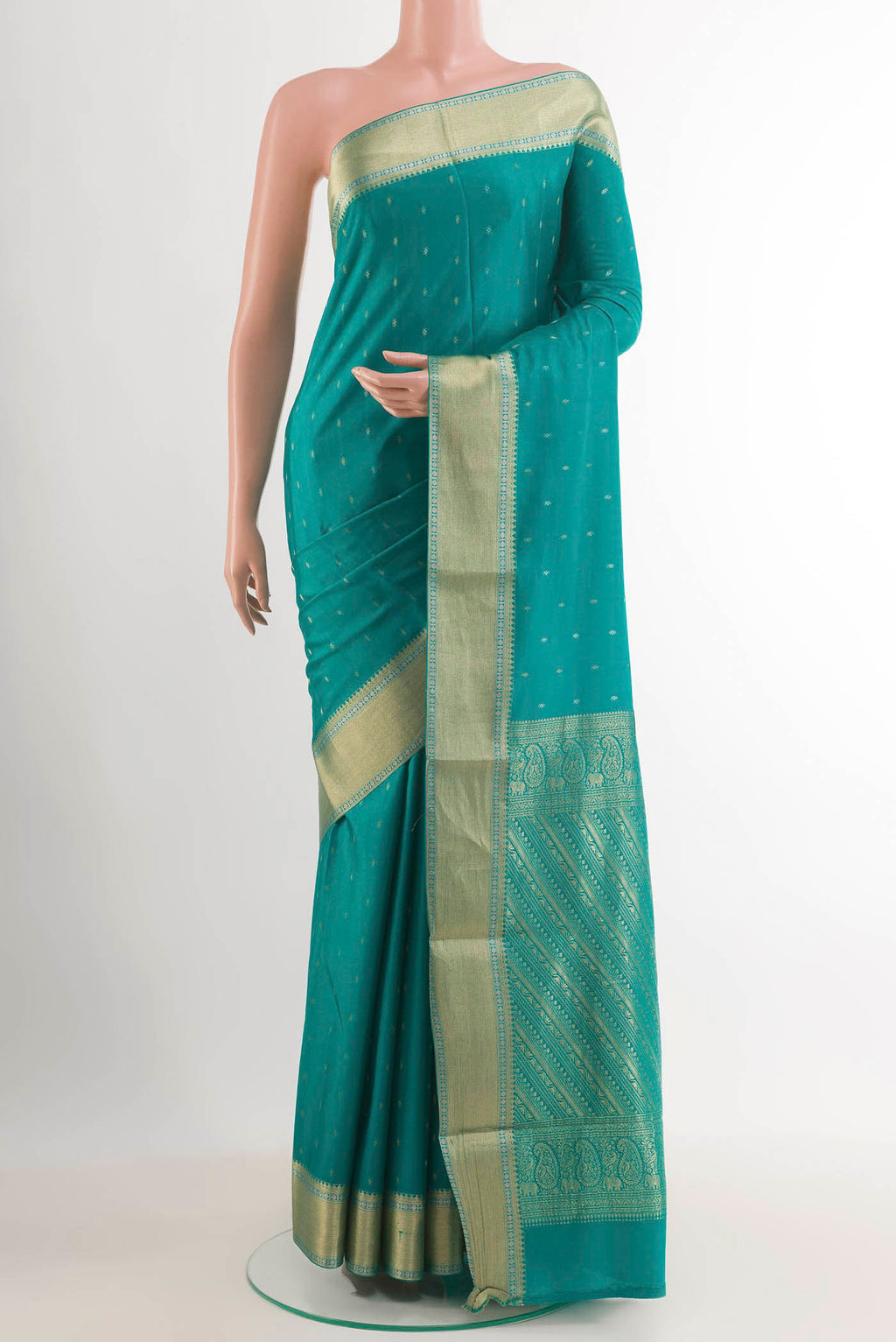 Sea Green Mysore Crepe Saree with Zari Butta on the body and Zari Border.  displayed on a mannequin