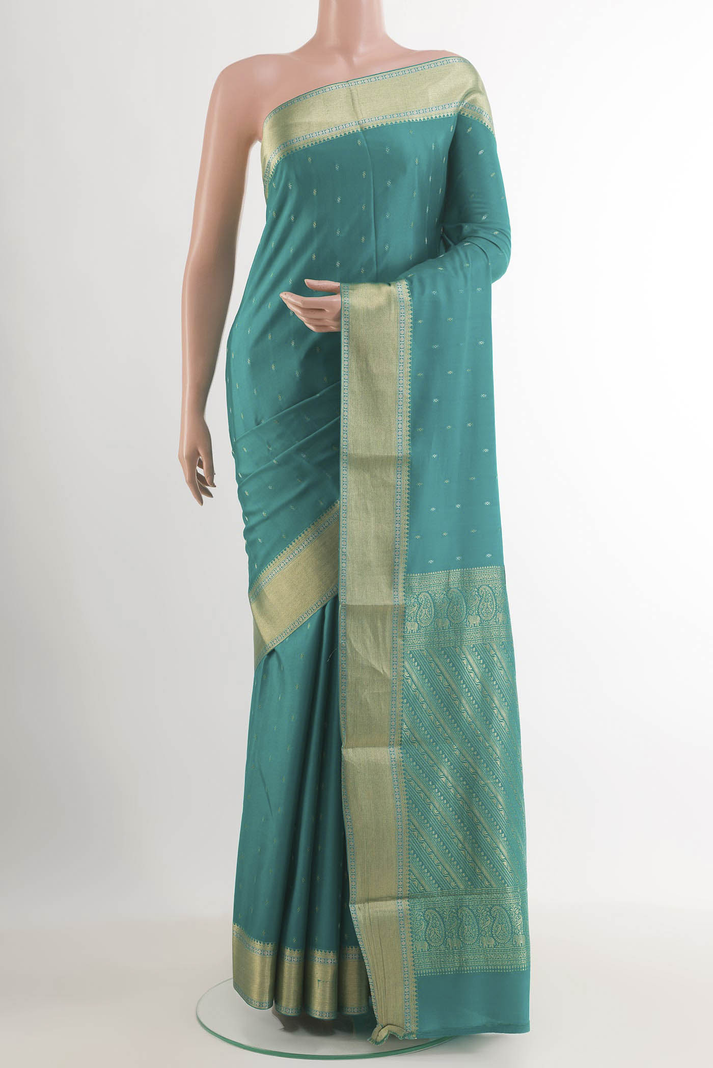 Sea Green Mysore Crepe Saree with Zari Butta on the body and Zari Border.  displayed on a mannequin